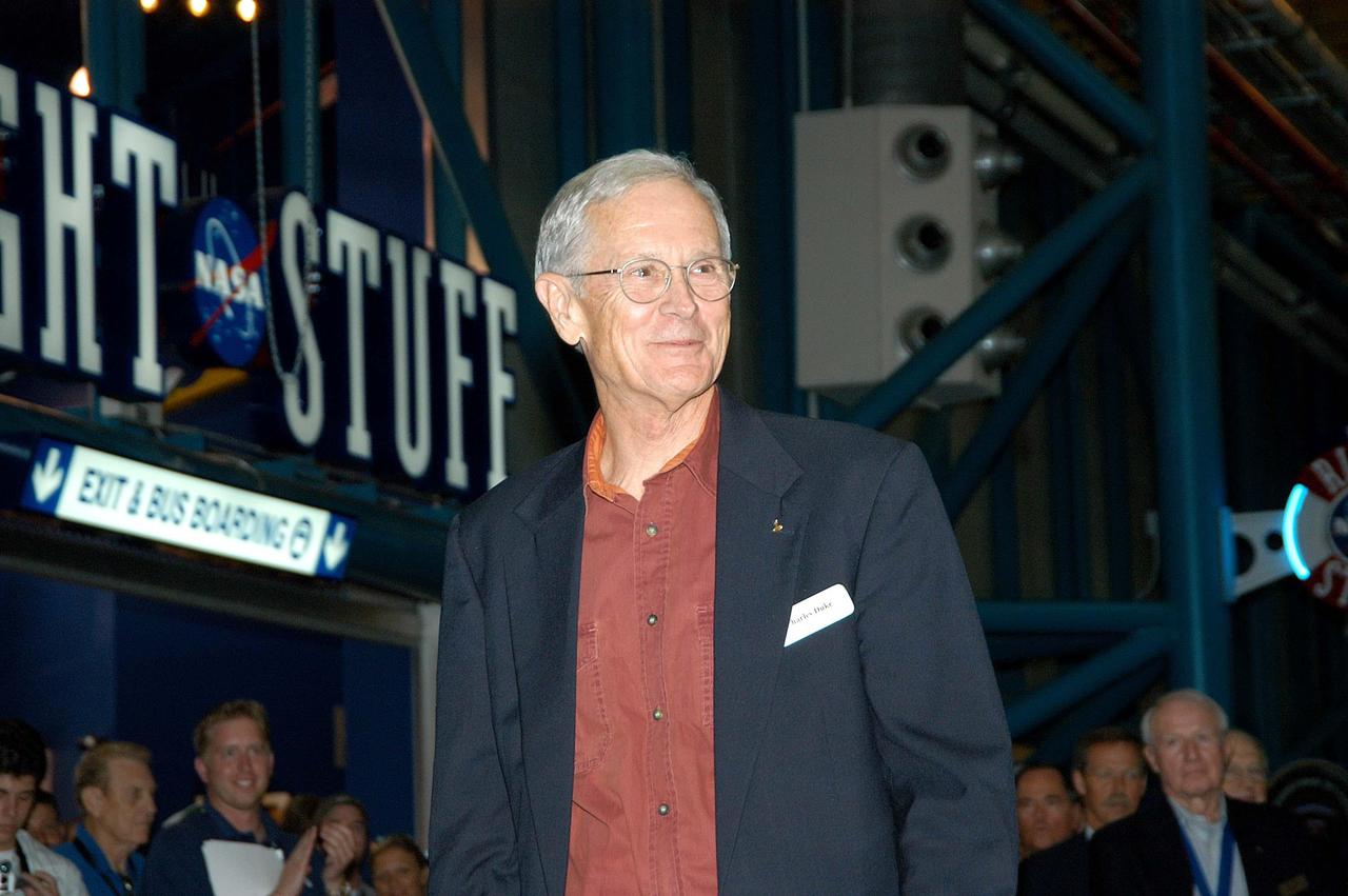 KENNEDY SPACE CENTER, FLA. --  Former astronaut Charles Duke receives a warm welcome as he is introduced as a previous inductee into the U.S. Astronaut Hall of Fame.  He and other  Hall of Fame members were present for the induction of five new space program heroes into the U.S. Astronaut Hall of Fame: Richard O. Covey, commander of the Hubble Space Telescope repair mission; Norman E. Thagard, the first American to occupy Russia’s Mir space station; the late Francis R. "Dick" Scobee, commander of the ill-fated 1986 Challenger mission; Kathryn D. Sullivan, the first American woman to walk in space; and Frederick D. Gregory, the first African-American to command a space mission and the current NASA deputy administrator.  Duke explored the rugged highlands of the Moon’s Descartes region with John Young during the Apollo 16 mission in April 1972.  The induction ceremony was held at the Apollo/Saturn V Center at KSC.  The U.S. Astronaut Hall of Fame opened in 1990 to provide a place where space travelers could be remembered for their participation and accomplishments in the U.S. space program. The five inductees join 52 previously honored astronauts from the ranks of the Gemini, Apollo, Skylab, Apollo-Soyuz, and Space Shuttle programs.