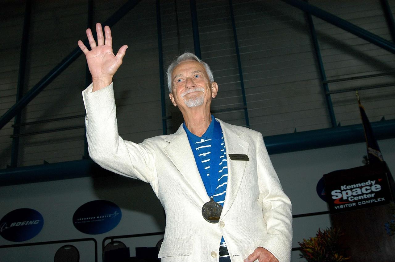 KENNEDY SPACE CENTER, FLA. --  Former astronaut Owen Garriott acknowledges the applause as he is introduced as a previous inductee into the U.S. Astronaut Hall of Fame.  He and other  Hall of Fame members were present for the induction of five new space program heroes into the U.S. Astronaut Hall of Fame: Richard O. Covey, commander of the Hubble Space Telescope repair mission; Norman E. Thagard, the first American to occupy Russia’s Mir space station; the late Francis R. "Dick" Scobee, commander of the ill-fated 1986 Challenger mission; Kathryn D. Sullivan, the first American woman to walk in space; and Frederick D. Gregory, the first African-American to command a space mission and the current NASA deputy administrator. Garriott exercised his expertise as a solar physicist on two space missions, the 59-day Skylab 3 flight in 1973, and an 11-day trip aboard the Space Shuttle Columbia a decade later. The induction ceremony was held at the Apollo/Saturn V Center at KSC.  The U.S. Astronaut Hall of Fame opened in 1990 to provide a place where space travelers could be remembered for their participation and accomplishments in the U.S. space program. The five inductees join 52 previously honored astronauts from the ranks of the Gemini, Apollo, Skylab, Apollo-Soyuz, and Space Shuttle programs.