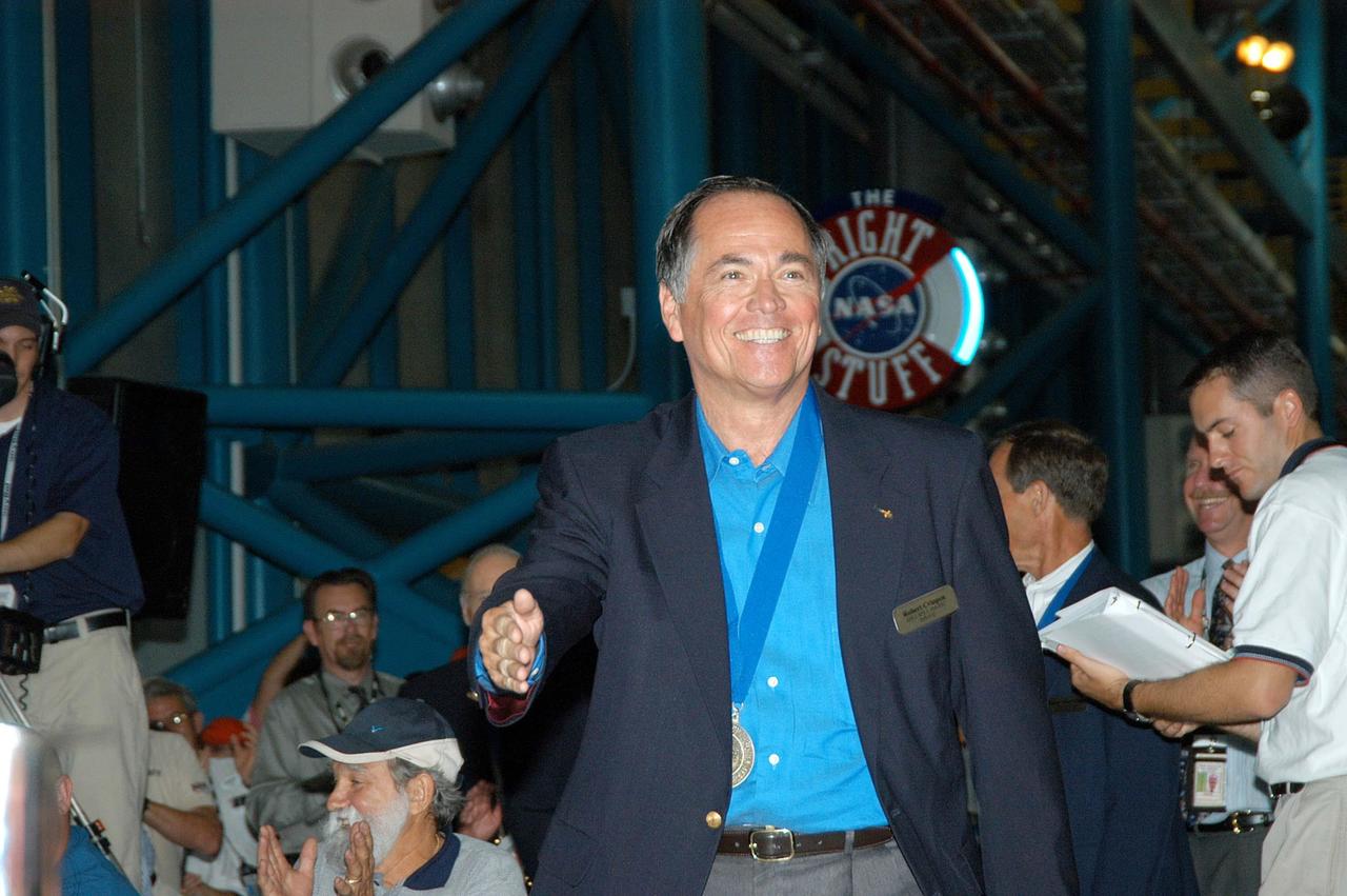 KENNEDY SPACE CENTER, FLA. --  Former astronaut Robert Crippen smiles at the warm greeting he is receiving when introduced as a previous inductee into the U.S. Astronaut Hall of Fame.  He and other  Hall of Fame members were present for the induction of five new space program heroes into the U.S. Astronaut Hall of Fame: Richard O. Covey, commander of the Hubble Space Telescope repair mission; Norman E. Thagard, the first American to occupy Russia’s Mir space station; the late Francis R. "Dick" Scobee, commander of the ill-fated 1986 Challenger mission; Kathryn D. Sullivan, the first American woman to walk in space; and Frederick D. Gregory, the first African-American to command a space mission and the current NASA deputy administrator.  Crippen piloted the first Space Shuttle flight in 1981 and commanded three other Shuttle missions in the next 3-1/2 years. In the early 1990s he served as director of NASA’s Kennedy Space Center. The induction ceremony was held at the Apollo/Saturn V Center at KSC.  The U.S. Astronaut Hall of Fame opened in 1990 to provide a place where space travelers could be remembered for their participation and accomplishments in the U.S. space program. The five inductees join 52 previously honored astronauts from the ranks of the Gemini, Apollo, Skylab, Apollo-Soyuz, and Space Shuttle programs.
