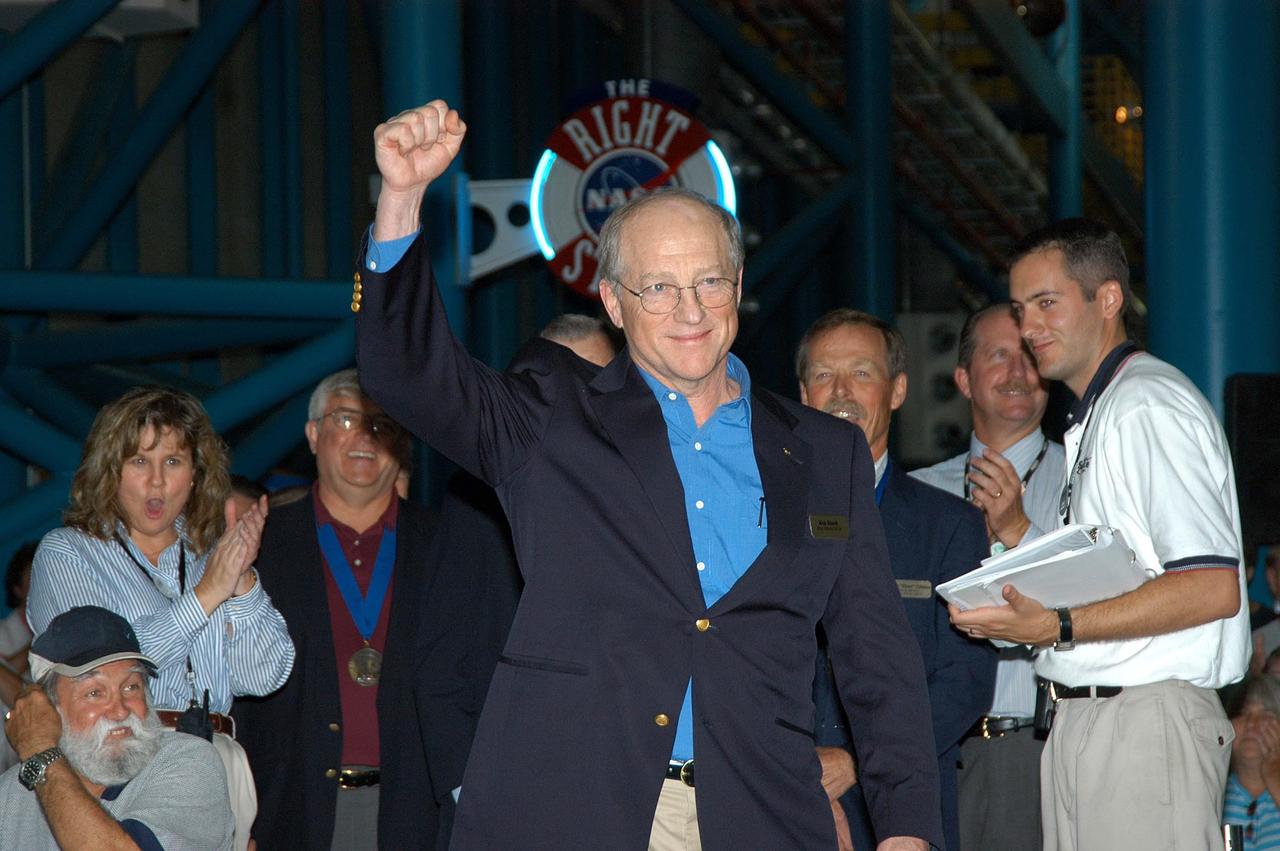 KENNEDY SPACE CENTER, FLA. --  Former astronaut Frederick (Rick) Hauck acknowledges the warm response to his introduction as a previous inductee into the U.S. Astronaut Hall of Fame.  He and other  Hall of Fame members were present for the induction of five new space program heroes into the U.S. Astronaut Hall of Fame: Richard O. Covey, commander of the Hubble Space Telescope repair mission; Norman E. Thagard, the first American to occupy Russia’s Mir space station; the late Francis R. "Dick" Scobee, commander of the ill-fated 1986 Challenger mission; Kathryn D. Sullivan, the first American woman to walk in space; and Frederick D. Gregory, the first African-American to command a space mission and the current NASA deputy administrator.  Hauck flew on three Space Shuttle missions, including command of the redesigned spaceship on its critical first flight after the explosion of Challenger.  The induction ceremony was held at the Apollo/Saturn V Center at KSC.  The U.S. Astronaut Hall of Fame opened in 1990 to provide a place where space travelers could be remembered for their participation and accomplishments in the U.S. space program. The five inductees join 52 previously honored astronauts from the ranks of the Gemini, Apollo, Skylab, Apollo-Soyuz, and Space Shuttle programs.