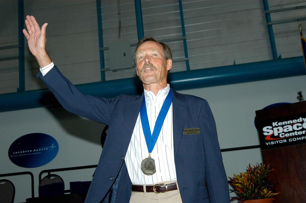 KENNEDY SPACE CENTER, FLA. --  Former astronaut Ed Gibson acknowledges the warm response to his introduction as a previous inductee into the U.S. Astronaut Hall of Fame.  He and other  Hall of Fame members were present for the induction of five new space program heroes into the U.S. Astronaut Hall of Fame: Richard O. Covey, commander of the Hubble Space Telescope repair mission; Norman E. Thagard, the first American to occupy Russia’s Mir space station; the late Francis R. "Dick" Scobee, commander of the ill-fated 1986 Challenger mission; Kathryn D. Sullivan, the first American woman to walk in space; and Frederick D. Gregory, the first African-American to command a space mission and the current NASA deputy administrator. Gibson orbited the Earth for 84 days during the final manned flight of the Skylab Space Station in 1973 and 1974.  The induction ceremony was held at the Apollo/Saturn V Center at KSC.  The U.S. Astronaut Hall of Fame opened in 1990 to provide a place where space travelers could be remembered for their participation and accomplishments in the U.S. space program. The five inductees join 52 previously honored astronauts from the ranks of the Gemini, Apollo, Skylab, Apollo-Soyuz, and Space Shuttle programs.