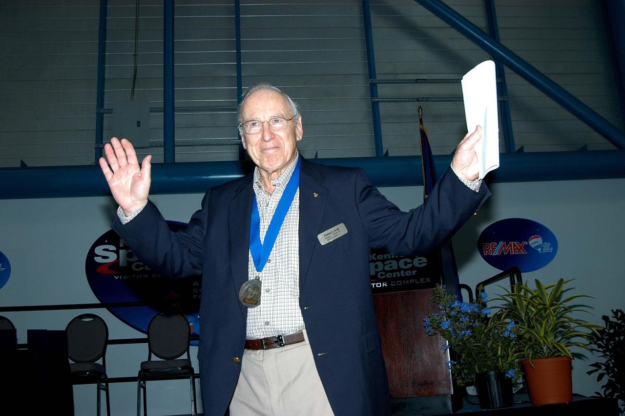 KENNEDY SPACE CENTER, FLA. -- Former astronaut Jim Lovell acknowledges the applause as he is introduced as a previous inductee into the U.S. Astronaut Hall of Fame.  He and other  Hall of Fame members were present for the induction of five new space program heroes into the U.S. Astronaut Hall of Fame: Richard O. Covey, commander of the Hubble Space Telescope repair mission; Norman E. Thagard, the first American to occupy Russia’s Mir space station; the late Francis R. "Dick" Scobee, commander of the ill-fated 1986 Challenger mission; Kathryn D. Sullivan, the first American woman to walk in space; and Frederick D. Gregory, the first African-American to command a space mission and the current NASA deputy administrator. Lovell piloted Gemini 7, commanded Gemini 12, orbited the Moon on Apollo 8 and commanded the aborted Apollo 13 moon flight.  The induction ceremony was held at the Apollo/Saturn V Center at KSC.  The U.S. Astronaut Hall of Fame opened in 1990 to provide a place where space travelers could be remembered for their participation and accomplishments in the U.S. space program. The five inductees join 52 previously honored astronauts from the ranks of the Gemini, Apollo, Skylab, Apollo-Soyuz, and Space Shuttle programs.