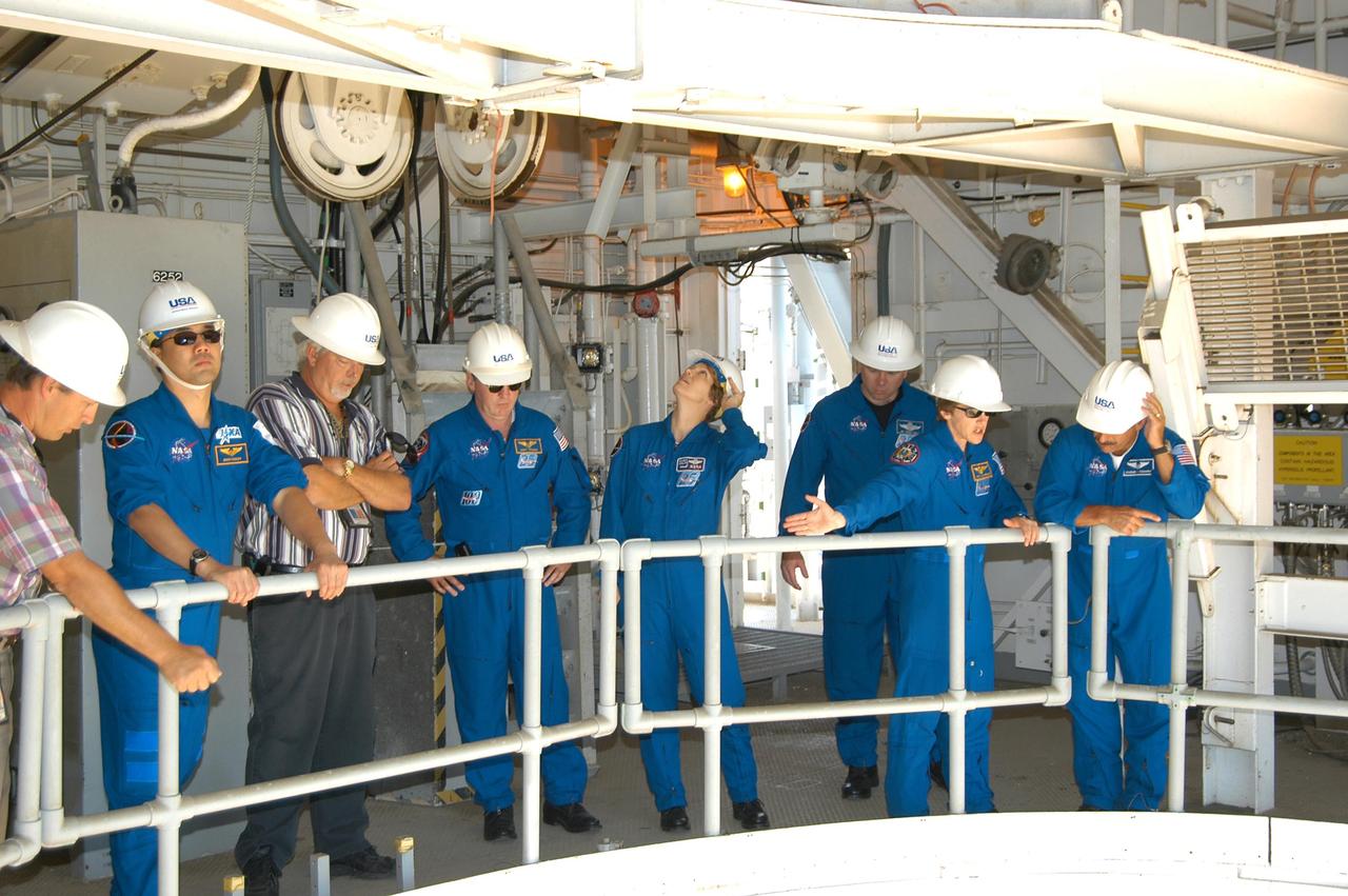 KENNEDY SPACE CENTER, FLA. -- The STS-114 crew look around Launch Pad 39A on a tour.  From left are Pad A Operations Manager David Sutherland (with United Space Alliance), Mission Specialist Soichi Noguchi, Pad A Operations Chief Steve Leonhard, with United Space Alliance, Mission Specialist Andrew Thomas, Mission Commander Eileen Collins, Pilot James Kelly, and Mission Specialists Wendy Lawrence and Charles Camarda.  Noguchi represents the Japanese Aerospace and Exploration Agency.  The STS-114 mission is Logistics Flight 1, which is scheduled to deliver supplies and equipment plus the external stowage platform to the International Space Station.