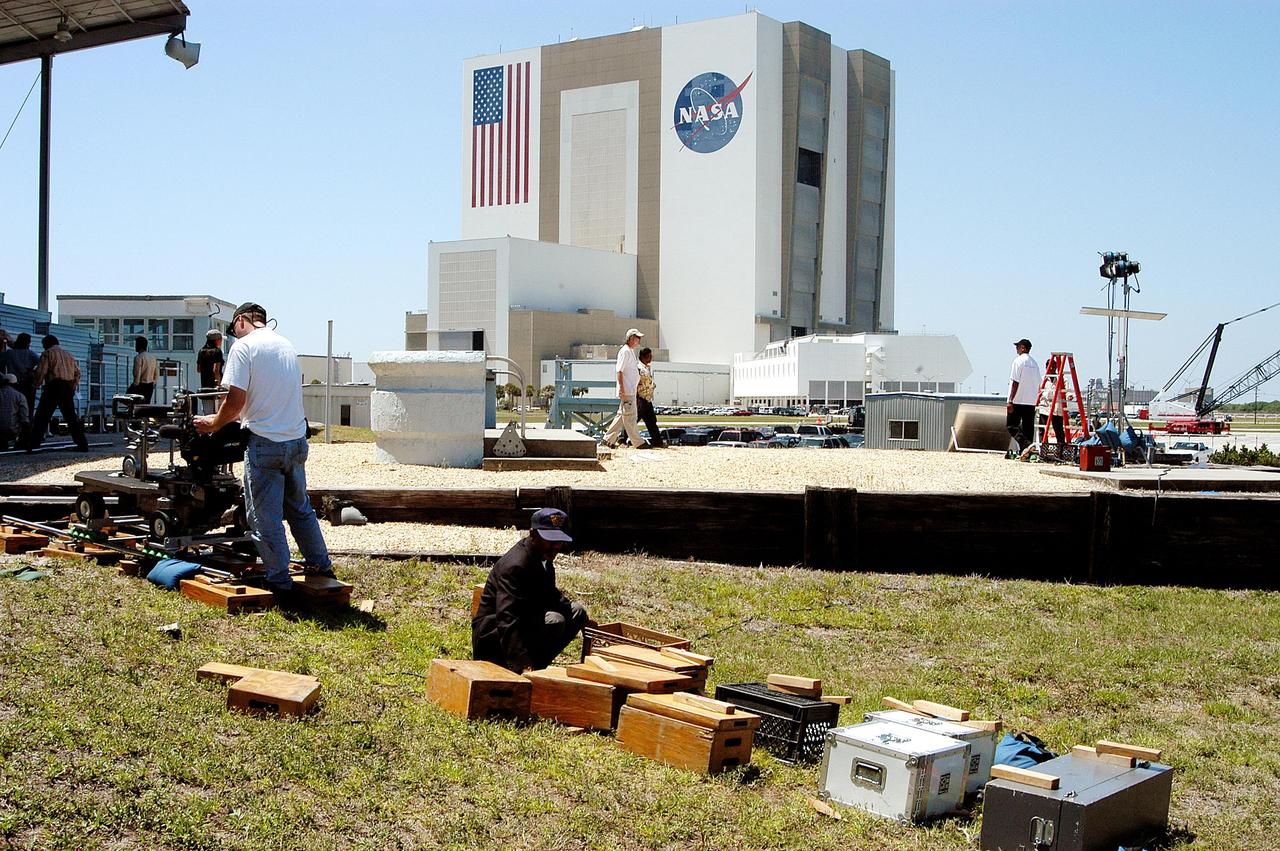 KENNEDY SPACE CENTER, FLA. -- A film crew from India sets up equipment at the viewing stands near the NASA News Center.  The crew spent several days at KSC filming at various sites for the movie “Swades,” a story about India’s brain-drain.  The writer and director  is Ashutosh Gowariker and lead actors are Shahrukh Khan and Gayatri Joshi. Sunita Gowariker is executive producer.
