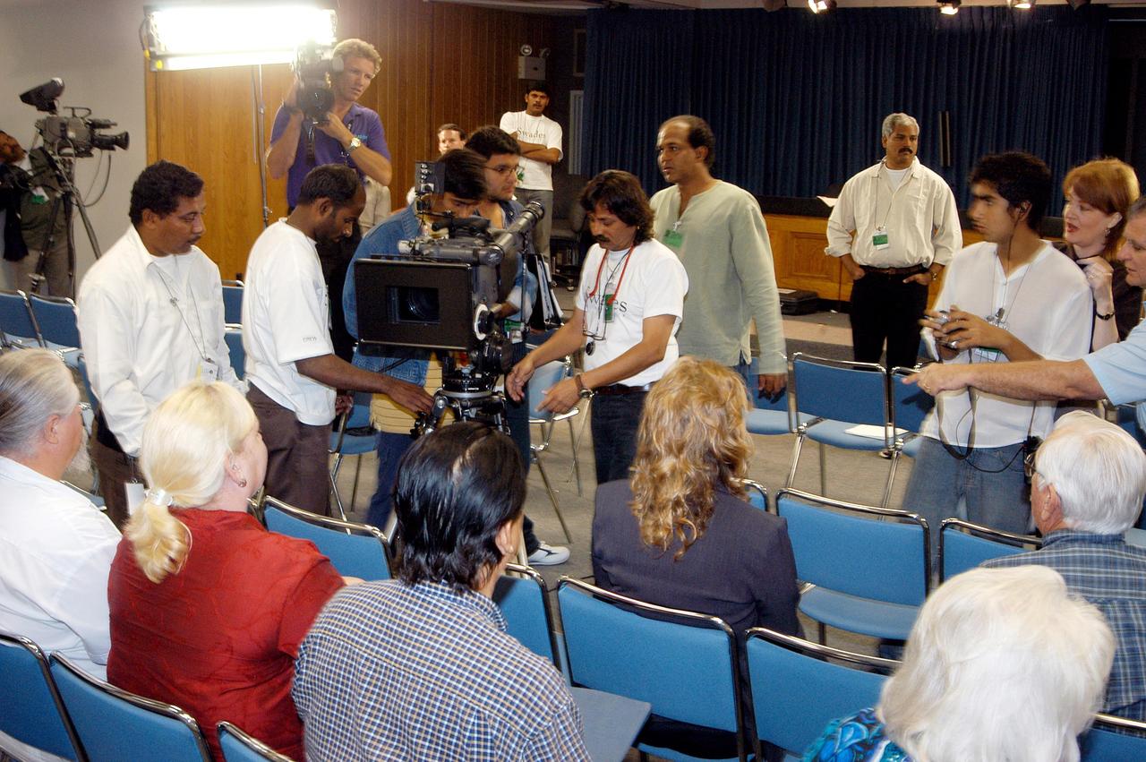 KENNEDY SPACE CENTER, FLA. -- A film crew from India sets up equipment inside the television studio at the NASA News Center.  The crew spent several days at KSC filming at various sites for the movie “Swades,” a story about India’s brain-drain.  At center is Mahesh Aney, director of photography.  The writer and director  is Ashutosh Gowariker (seen to the right of Aney).  The lead actors are Shahrukh Khan and Gayatri Joshi. Sunita Gowariker is executive producer.
