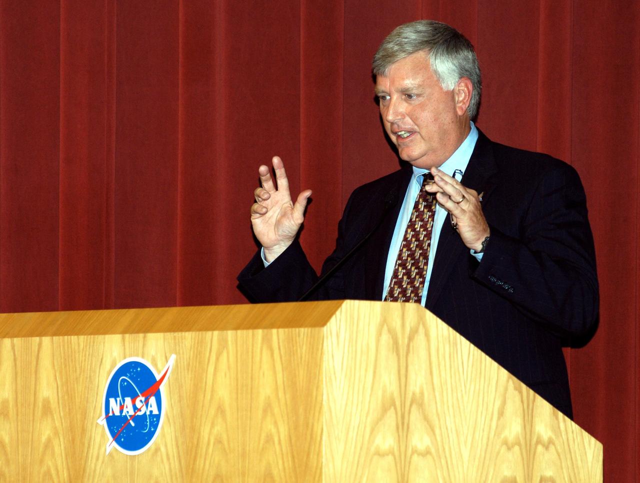 KENNEDY SPACE CENTER, FLA. -- Center Director James W. Kennedy addresses KSC employees assembled in the Training Auditorium for a Culture Change Process All Hands Meeting. The purpose of the meeting was for employees to gain further insight into the Agency’s Vision for Space Exploration and the direction cultural change will take at KSC in order to assume its role within this vision. Other participants included Jim Jennings, Deputy Associate Administrator for Institutions and Asset Management; Lynn Cline, Deputy Associate Administrator for Space Flight; Bob Sieck, former Director of Space Shuttle Processing at KSC; and Jim Wetherbee, astronaut and Technical Assistant to the Director of Safety and Mission Assurance at Johnson Space Center. Following their remarks, members of the panel entertained questions and comments from the audience.