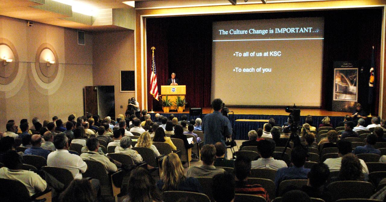 KENNEDY SPACE CENTER, FLA. -- Center Director James W. Kennedy addresses KSC employees assembled in the Training Auditorium for a Culture Change Process All Hands Meeting. The purpose of the meeting was for employees to gain further insight into the Agency’s Vision for Space Exploration and the direction cultural change will take at KSC in order to assume its role within this vision. Other participants included Jim Jennings, Deputy Associate Administrator for Institutions and Asset Management; Lynn Cline, Deputy Associate Administrator for Space Flight; Bob Sieck, former Director of Space Shuttle Processing at KSC; and Jim Wetherbee, astronaut and Technical Assistant to the Director of Safety and Mission Assurance at Johnson Space Center. Following their remarks, members of the panel entertained questions and comments from the audience.