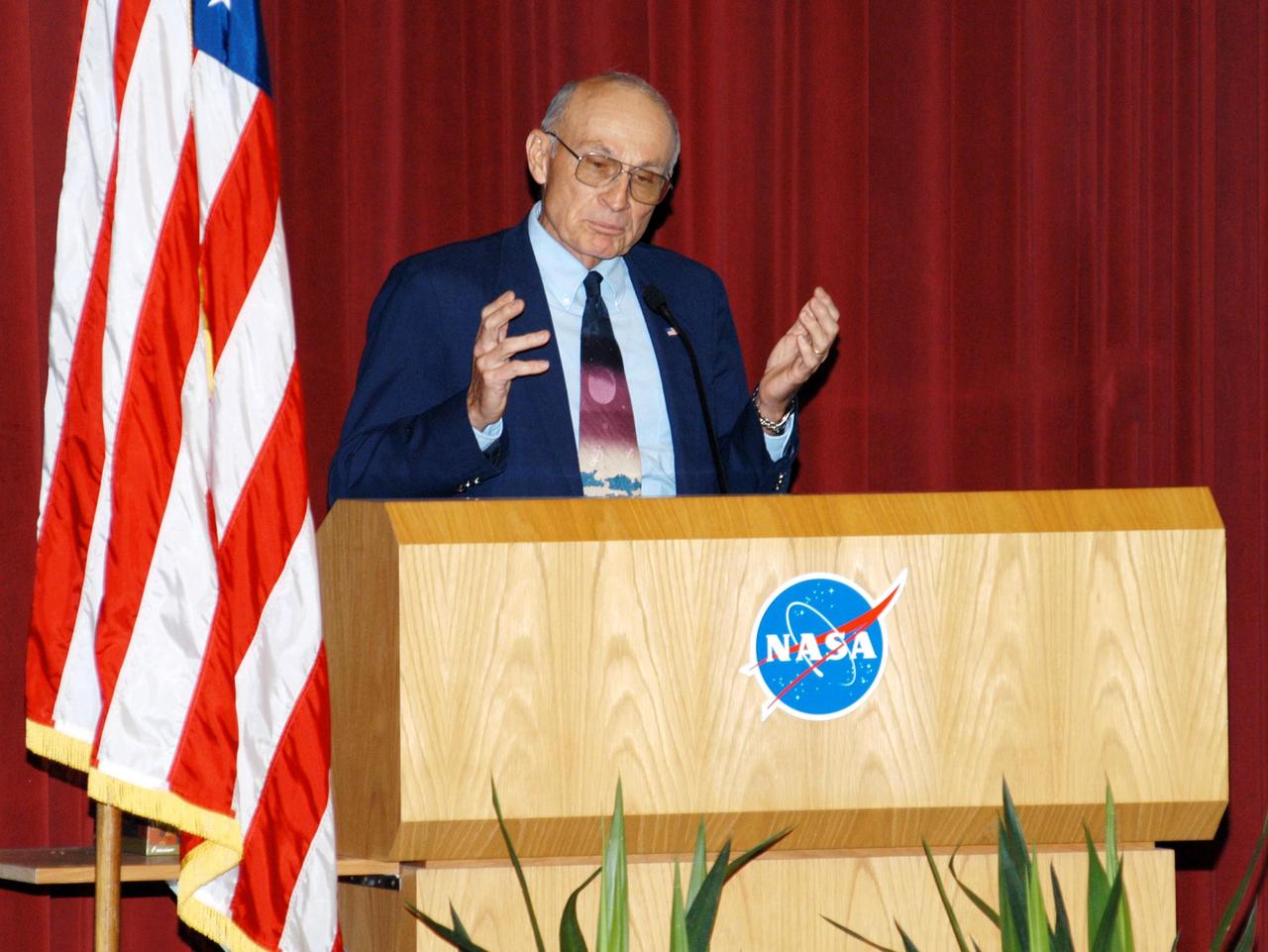 KENNEDY SPACE CENTER, FLA. -- Bob Sieck, former Director of Space Shuttle Processing at KSC addresses KSC employees assembled in the Training Auditorium for a Culture Change Process All Hands Meeting. The purpose of the meeting was for employees to gain further insight into the Agency’s Vision for Space Exploration and the direction cultural change will take at KSC in order to assume its role within this vision. Other participants included James W. Kennedy, KSC director; Jim Jennings, Deputy Associate Administrator for Institutions and Asset Management; Lynn Cline, Deputy Associate Administrator for Space Flight; and Jim Wetherbee, astronaut and Technical Assistant to the Director of Safety and Mission Assurance at Johnson Space Center. Following their remarks, members of the panel entertained questions and comments from the audience.