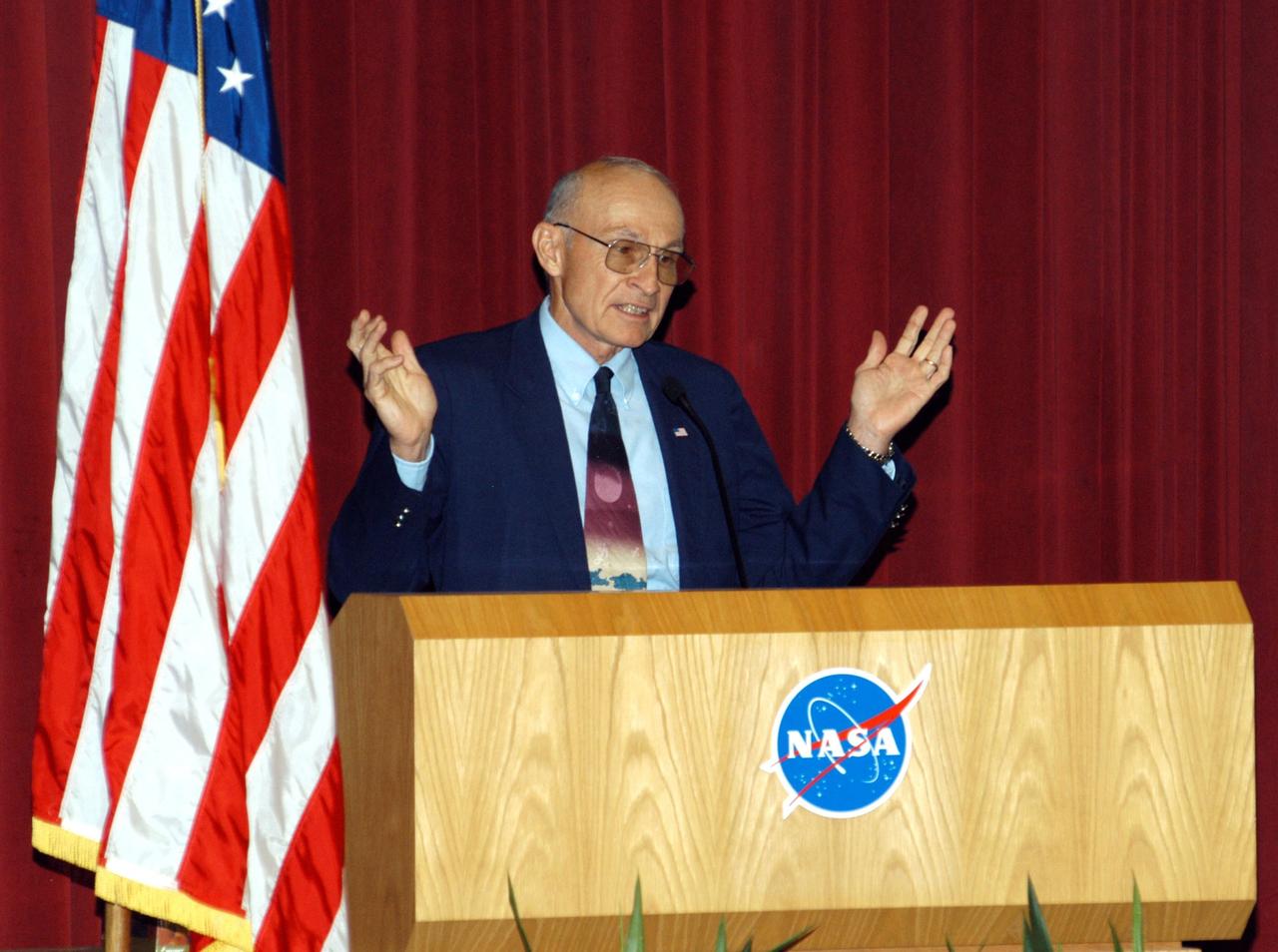 KENNEDY SPACE CENTER, FLA. -- Bob Sieck, former Director of Space Shuttle Processing at KSC addresses KSC employees assembled in the Training Auditorium for a Culture Change Process All Hands Meeting. The purpose of the meeting was for employees to gain further insight into the Agency’s Vision for Space Exploration and the direction cultural change will take at KSC in order to assume its role within this vision. Other participants included James W. Kennedy, KSC director; Jim Jennings, Deputy Associate Administrator for Institutions and Asset Management; Lynn Cline, Deputy Associate Administrator for Space Flight; and Jim Wetherbee, astronaut and Technical Assistant to the Director of Safety and Mission Assurance at Johnson Space Center. Following their remarks, members of the panel entertained questions and comments from the audience.