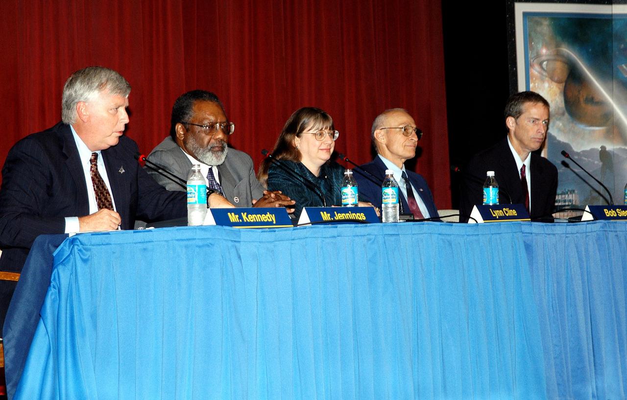 KENNEDY SPACE CENTER, FLA. -- The panel members participating in the Culture Change Process All Hands Meeting entertain questions and comments from the audience assembled in the Training Auditorium. From left, they are James W. Kennedy, KSC director; Jim Jennings, Deputy Associate Administrator for Institutions and Asset Management; Lynn Cline, Deputy Associate Administrator for Space Flight; Bob Sieck, former Director of Space Shuttle Processing at KSC; and Jim Wetherbee, astronaut and Technical Assistant to the Director of Safety and Mission Assurance at Johnson Space Center. The purpose of the meeting was for employees to gain further insight into the Agency’s Vision for Space Exploration and the direction cultural change will take at KSC in order to assume its role within this vision.