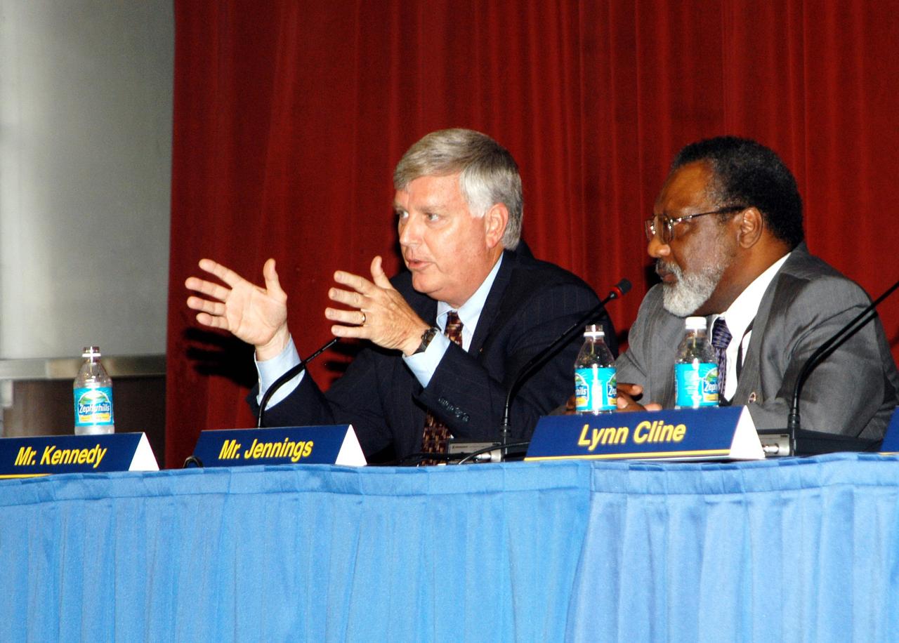 KENNEDY SPACE CENTER, FLA. -- Jim Jennings (right), Deputy Associate Administrator for Institutions and Asset Management, looks on as James W. Kennedy, KSC director, answers a question raised by a member of the audience attending the Culture Change Process All Hands Meeting in the Training Auditorium. The purpose of the meeting was for employees to gain further insight into the Agency’s Vision for Space Exploration and the direction cultural change will take at KSC in order to assume its role within this vision. Other panel members were Lynn Cline, Deputy Associate Administrator for Space Flight; Bob Sieck, former Director of Space Shuttle Processing at KSC; and Jim Wetherbee, astronaut and Technical Assistant to the Director of Safety and Mission Assurance at Johnson Space Center.