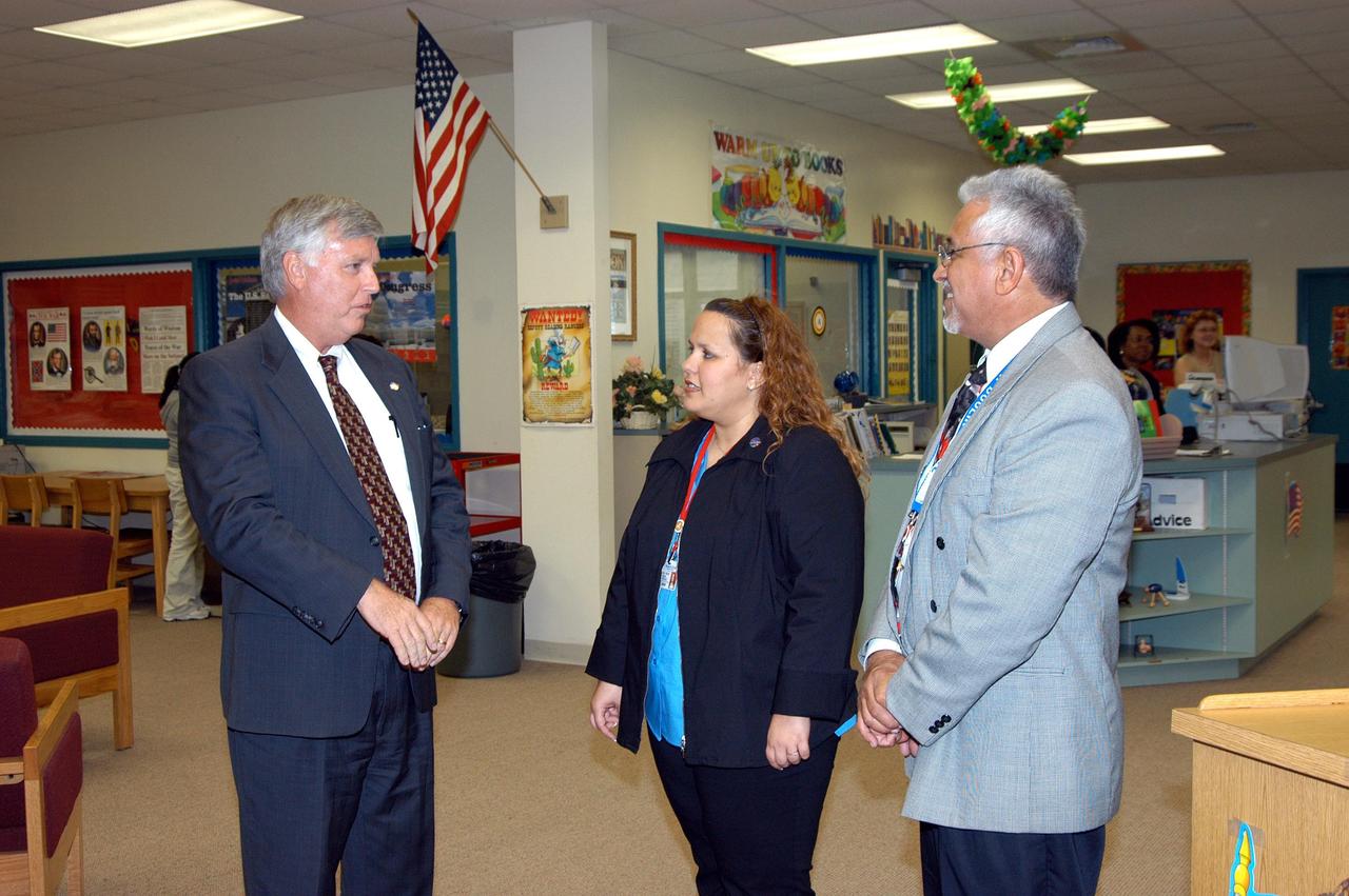 KENNEDY SPACE CENTER, FLA. -- Center Director Jim Kennedy (left) talks to Eduardo Tillet (right), principal of Howard A. Doolin Middle School, Miami, Fla., on his visit to share America’s new vision for space exploration with the next generation of explorers. Kennedy, joined by astronaut David Wolf, is talking with students about our destiny as explorers, NASA’s stepping stone approach to exploring Earth, the Moon, Mars and beyond, how space impacts our lives, and how people and machines rely on each other in space.