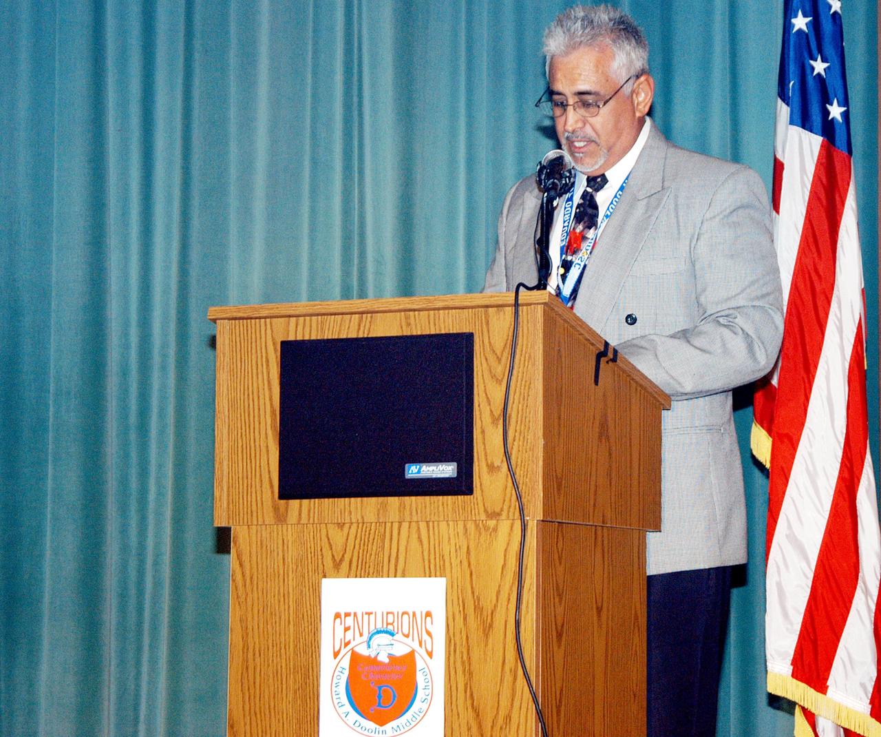 KENNEDY SPACE CENTER, FLA. -- Eduardo Tillet, principal of Howard A. Doolin Middle School, Miami, Fla., welcomes Center Director Jim Kennedy, plus NASA and KSC representatives, to the school. Doolin Middle School is one of 100 to take part in the NASA Explorer Schools (NES) program. Kennedy is talking with students, about our destiny as explorers, NASA’s stepping stone approach to exploring Earth, the Moon, Mars and beyond, how space impacts our lives, and how people and machines rely on each other in space. He is visiting NES schools in Florida and Georgia to share America’s new vision for space exploration with the next generation of explorers.