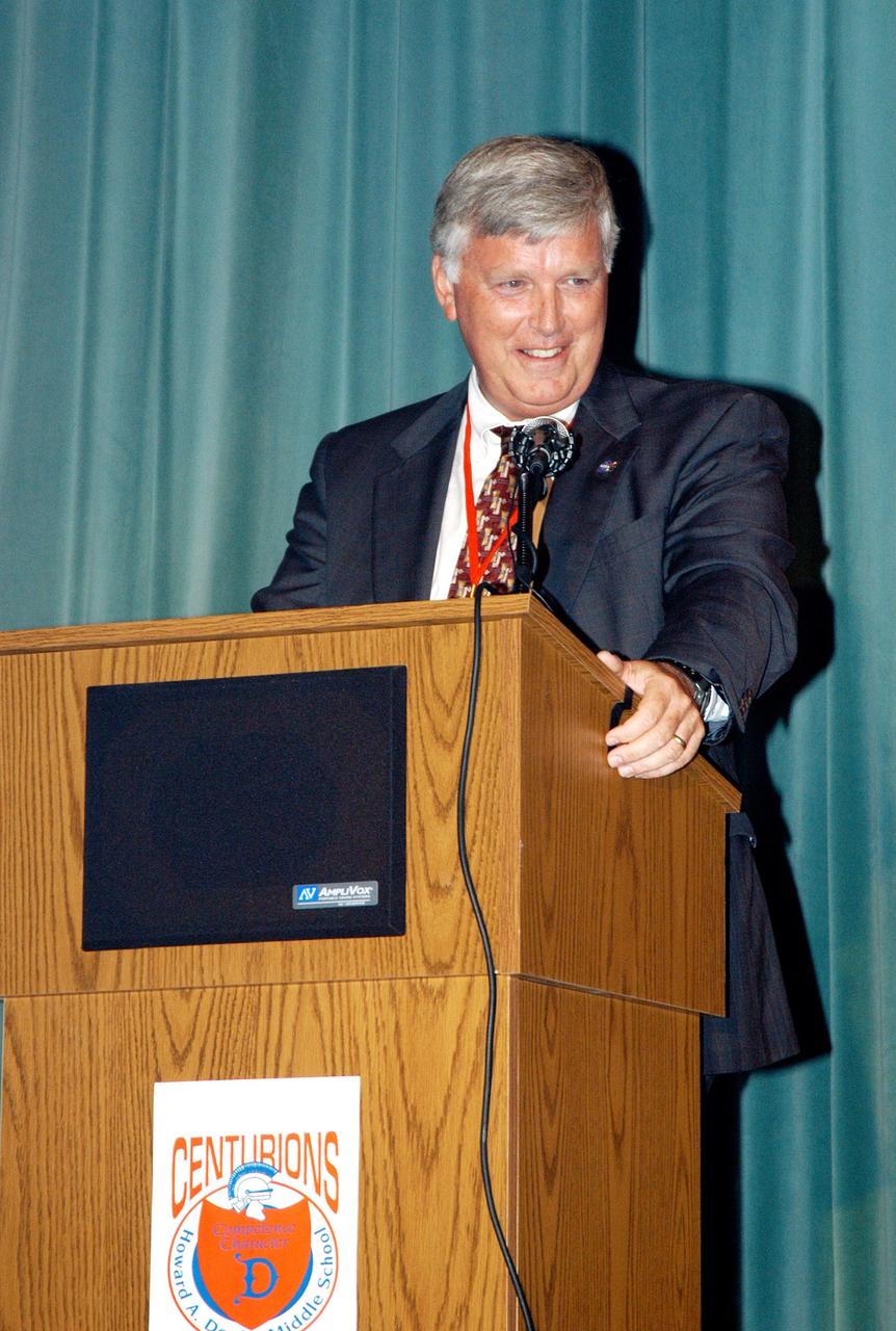 KENNEDY SPACE CENTER, FLA. -- Center Director Jim Kennedy addresses students and faculty of Howard A. Doolin Middle School, Miami, Fla. Doolin Middle School is one of 100 to take part in the NASA Explorer Schools (NES) program. Kennedy is visiting NES schools in Florida and Georgia to share America’s new vision for space exploration with the next generation of explorers. He is talking with students, about our destiny as explorers, NASA’s stepping stone approach to exploring Earth, the Moon, Mars and beyond, how space impacts our lives, and how people and machines rely on each other in space.