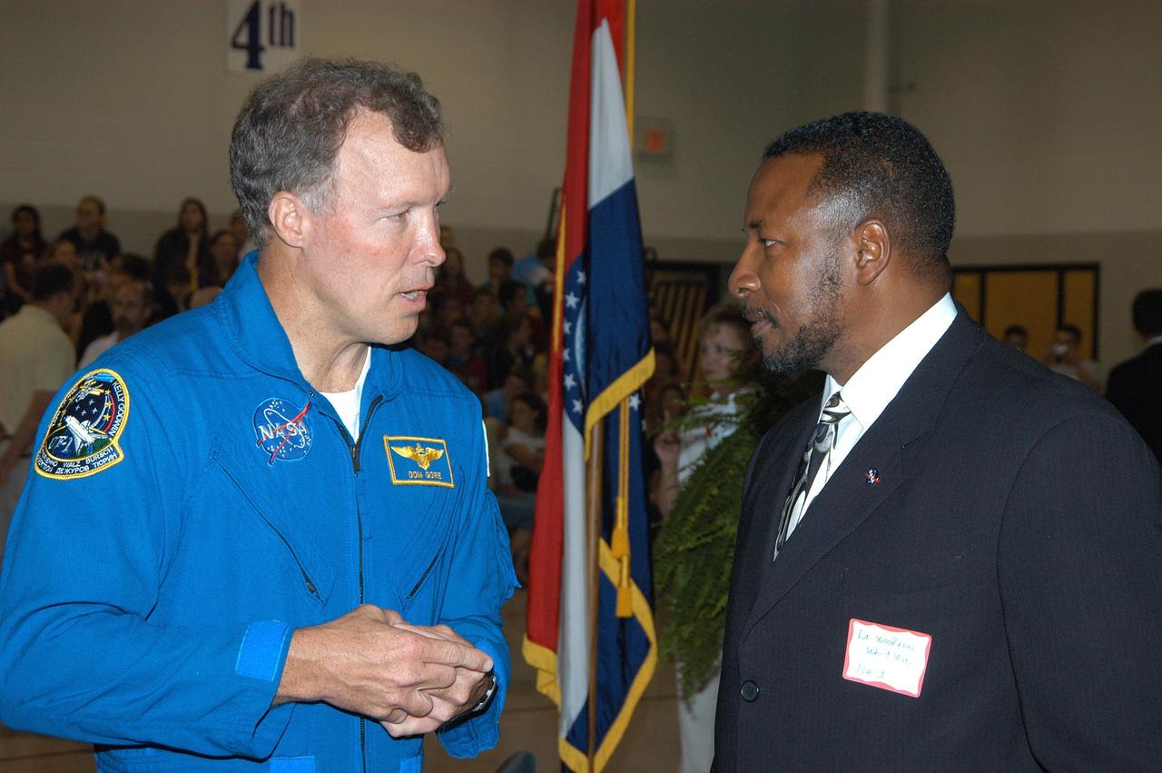 KENNEDY SPACE CENTER, FLA. -- Astronaut Dom Gorie (left) talks with KSC Deputy Director Dr. Woodrow Whitlow during a visit to Trojan Intermediate School in Potosi, Mo.  Students from three area schools — Potosi High School, John Evans Middle School and Trojan — are on a team taking part in NASA’s Explorer Schools program.  Gorie accompanied Whitlow on a visit to the school to share America’s new vision for space exploration with the next generation of explorers. They are talking with students about our destiny as explorers, NASA’s stepping stone approach to exploring Earth, the Moon, Mars and beyond, how space impacts our lives, and how people and machines rely on each other in space.
