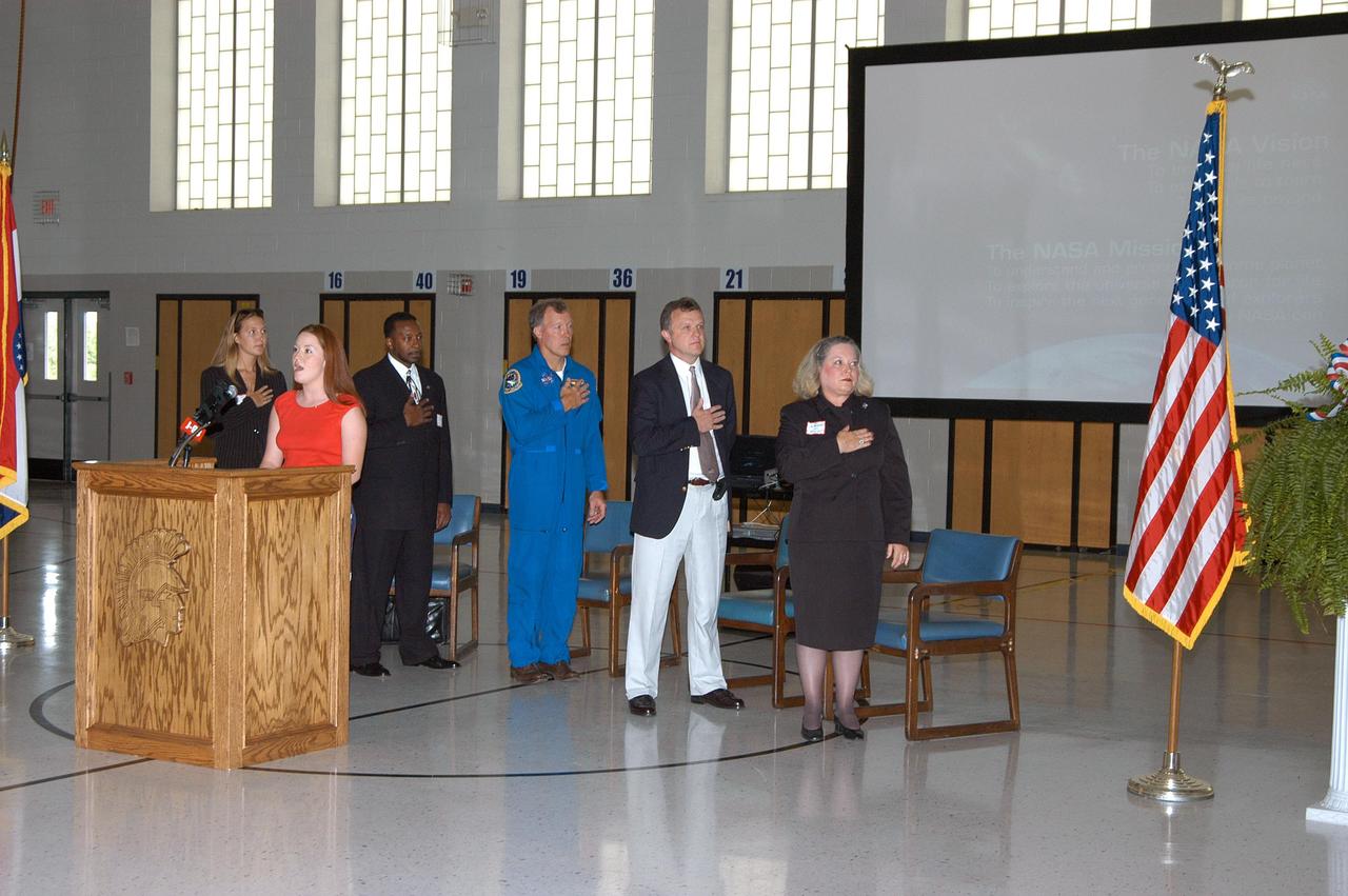 KENNEDY SPACE CENTER, FLA. -- Prior to a presentation at Trojan Intermediate School in Potosi, Mo., Amber Marek, KSC Deputy Director Dr. Woodrow Whitlow, astronaut Dom Gorie,  Superintendent of Schools Randy Davis and Principal Jo Peukert salute the American flag. Students from three area schools— Potosi High School, John Evans Middle School and Trojan — are on a team taking part in NASA’s Explorer Schools program.  Whitlow and Gorie are visiting the school to share America’s new vision for space exploration with the next generation of explorers. They are talking with students about our destiny as explorers, NASA’s stepping stone approach to exploring Earth, the Moon, Mars and beyond, how space impacts our lives, and how people and machines rely on each other in space.