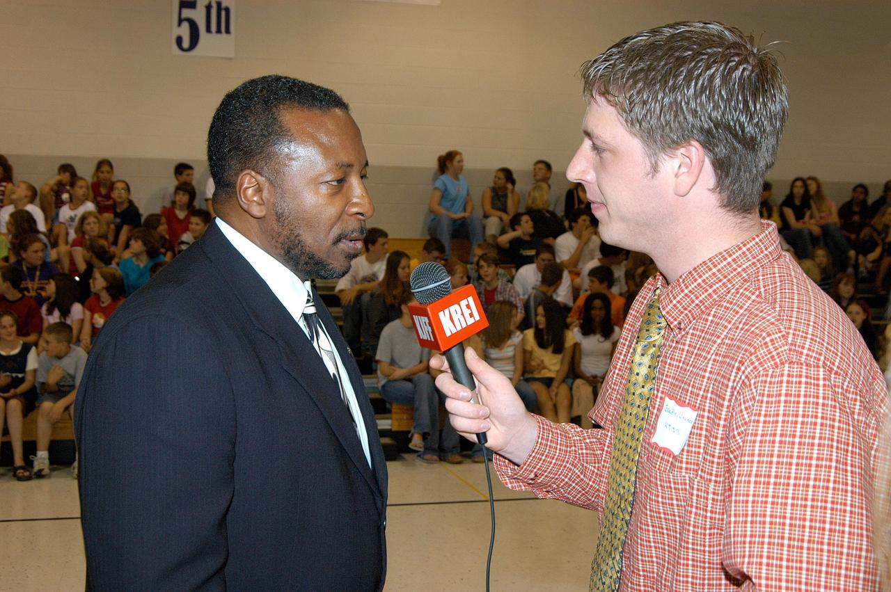 KENNEDY SPACE CENTER, FLA. -- A reporter from KREI radio interviews KSC Deputy Director Dr. Woodrow Whitlow after his presentation at Trojan Intermediate School in Potosi, Mo.  Students from three area schools — Potosi High School, John Evans Middle School and Trojan — are on a team taking part in NASA’s Explorer Schools program.  Whitlow is sharing America’s new vision for space exploration with the next generation of explorers. They are talking with students about our destiny as explorers, NASA’s stepping stone approach to exploring Earth, the Moon, Mars and beyond, how space impacts our lives, and how people and machines rely on each other in space.