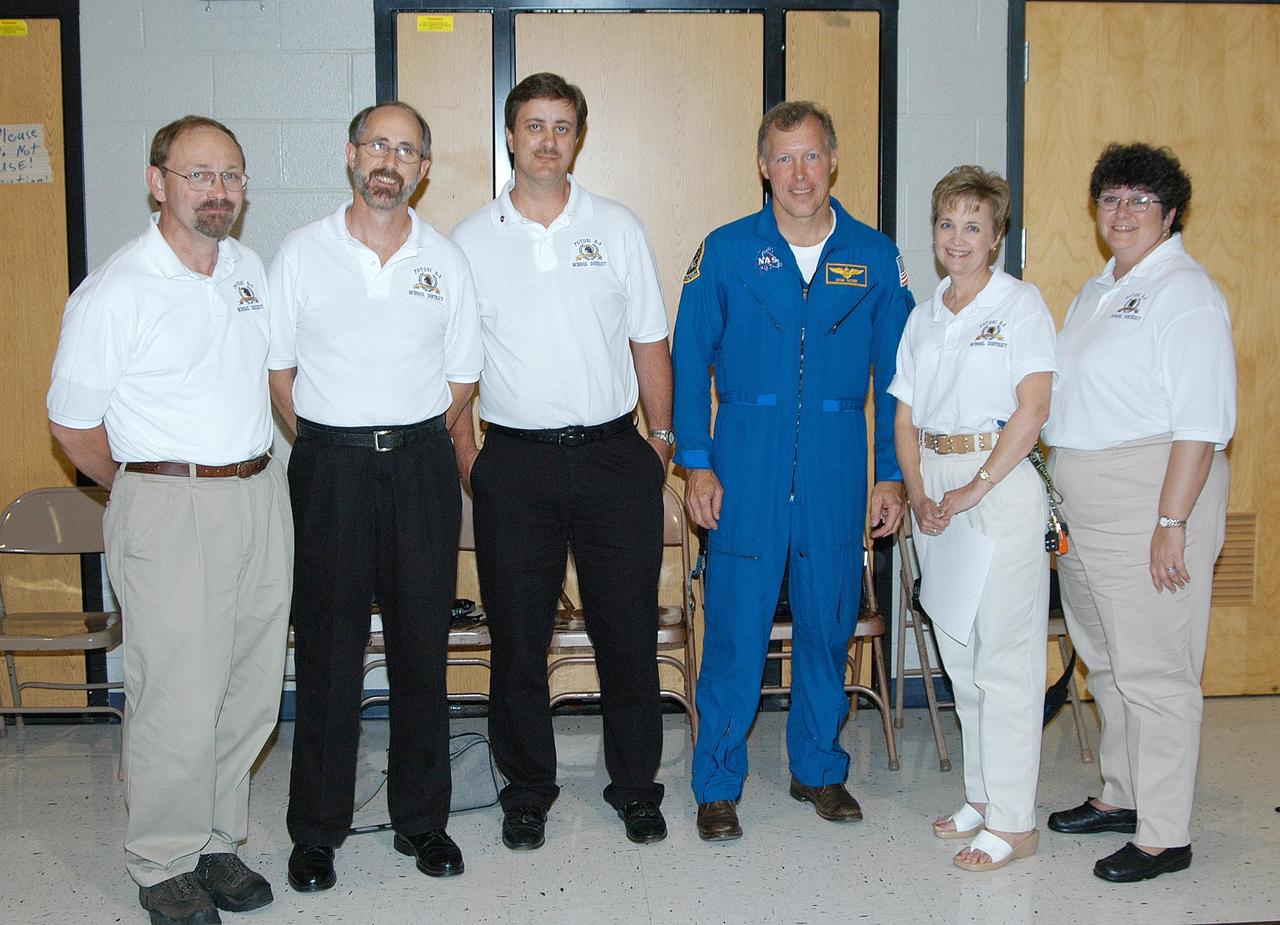 KENNEDY SPACE CENTER, FLA. -- Astronaut Dom Gorie joins faculty members of Trojan Intermediate School in Potosi, Mo., for a photo.  Students from three area schools — Potosi High School, John Evans Middle School and Trojan — are on a team taking part in NASA’s Explorer Schools program.  KSC Deputy Director Dr. Woodrow Whitlow and Gore are sharing America’s new vision for space exploration with the next generation of explorers. They are talking with students about our destiny as explorers, NASA’s stepping stone approach to exploring Earth, the Moon, Mars and beyond, how space impacts our lives, and how people and machines rely on each other in space.