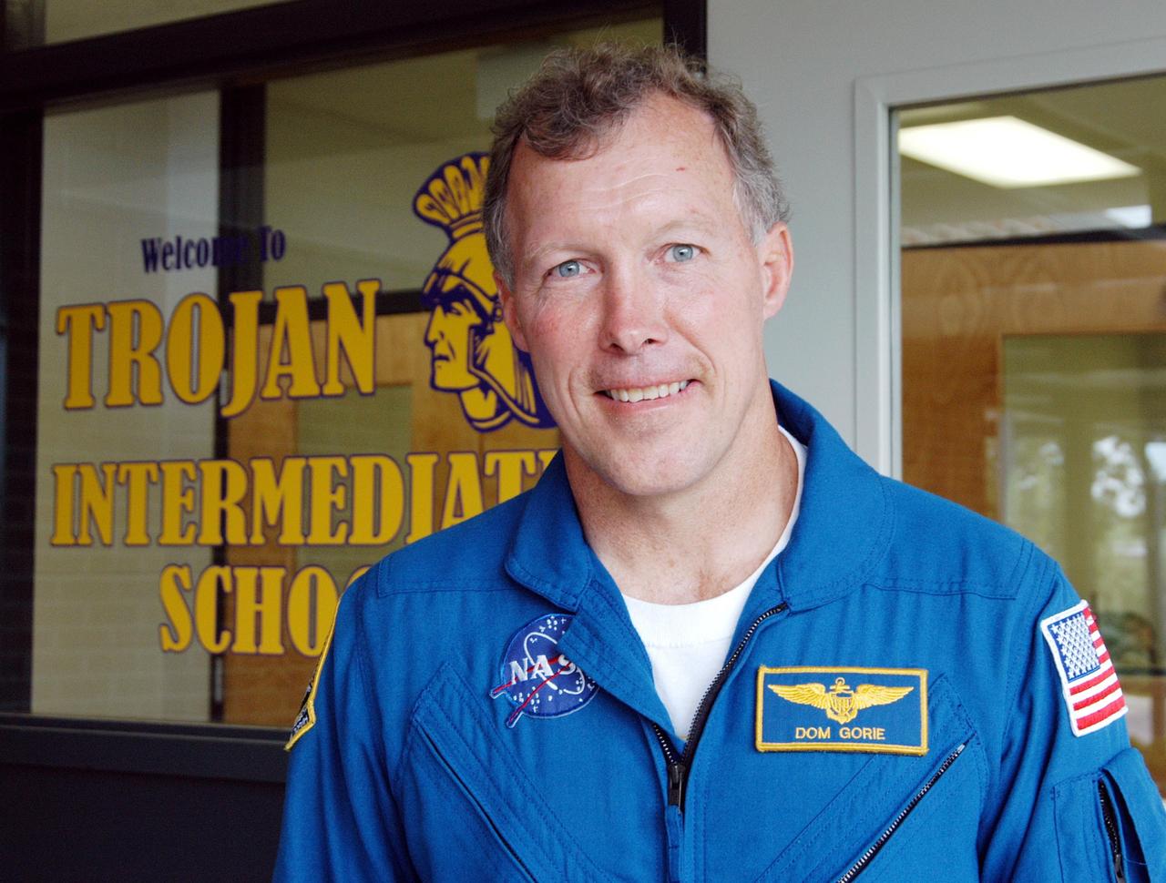 KENNEDY SPACE CENTER, FLA. -- Astronaut Dom Gorie stands outside the office at Trojan Intermediate School in Potosi, Mo.  He and KSC Deputy Director Dr. Woodrow Whitlow gave a presentation to students to share America’s new vision for space exploration with the next generation of explorers. He is talking with students about our destiny as explorers, NASA’s stepping stone approach to exploring Earth, the Moon, Mars and beyond, how space impacts our lives, and how people and machines rely on each other in space.  Students from three area schools — Potosi High School, John Evans Middle School and Trojan — are on a team taking part in NASA’s Explorer Schools program.