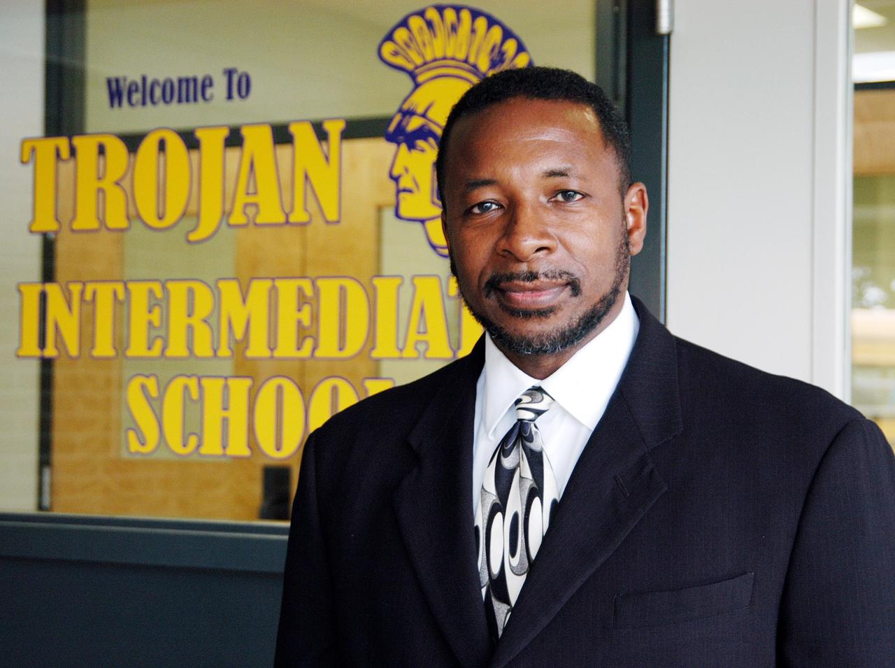KENNEDY SPACE CENTER, FLA. -- KSC Deputy Director Dr. Woodrow Whitlow stands outside the office at Trojan Intermediate School in Potosi, Mo.  He gave a presentation to students to share America’s new vision for space exploration with the next generation of explorers. He is talking with students about our destiny as explorers, NASA’s stepping stone approach to exploring Earth, the Moon, Mars and beyond, how space impacts our lives, and how people and machines rely on each other in space.  Students from three area schools — Potosi High School, John Evans Middle School and Trojan — are on a team taking part in NASA’s Explorer Schools program.