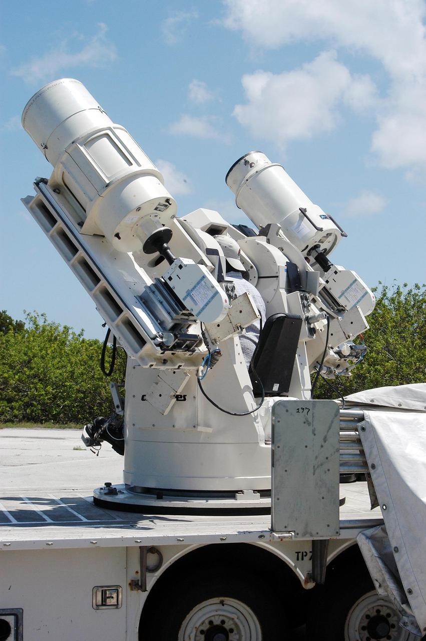 KENNEDY SPACE CENTER, FLA. -- Johnson Controls operator Kenny Allen checks out one of the recently acquired Contraves-Goerz Kineto Tracking Mounts (KTM). There are 10 KTMs certified for use on the Eastern Range. The KTM, which is trailer-mounted with an electric drive tracking mount, includes a two-camera, camera control unit that will be used during launches. The KTM is designed for remotely controlled operations and offers a combination of film, shuttered and high-speed digital video, and FLIR cameras configured with 20-inch to 150-inch focal length lenses. The KTMs are generally placed in the field and checked out the day before a launch and manned 3 hours prior to liftoff.
