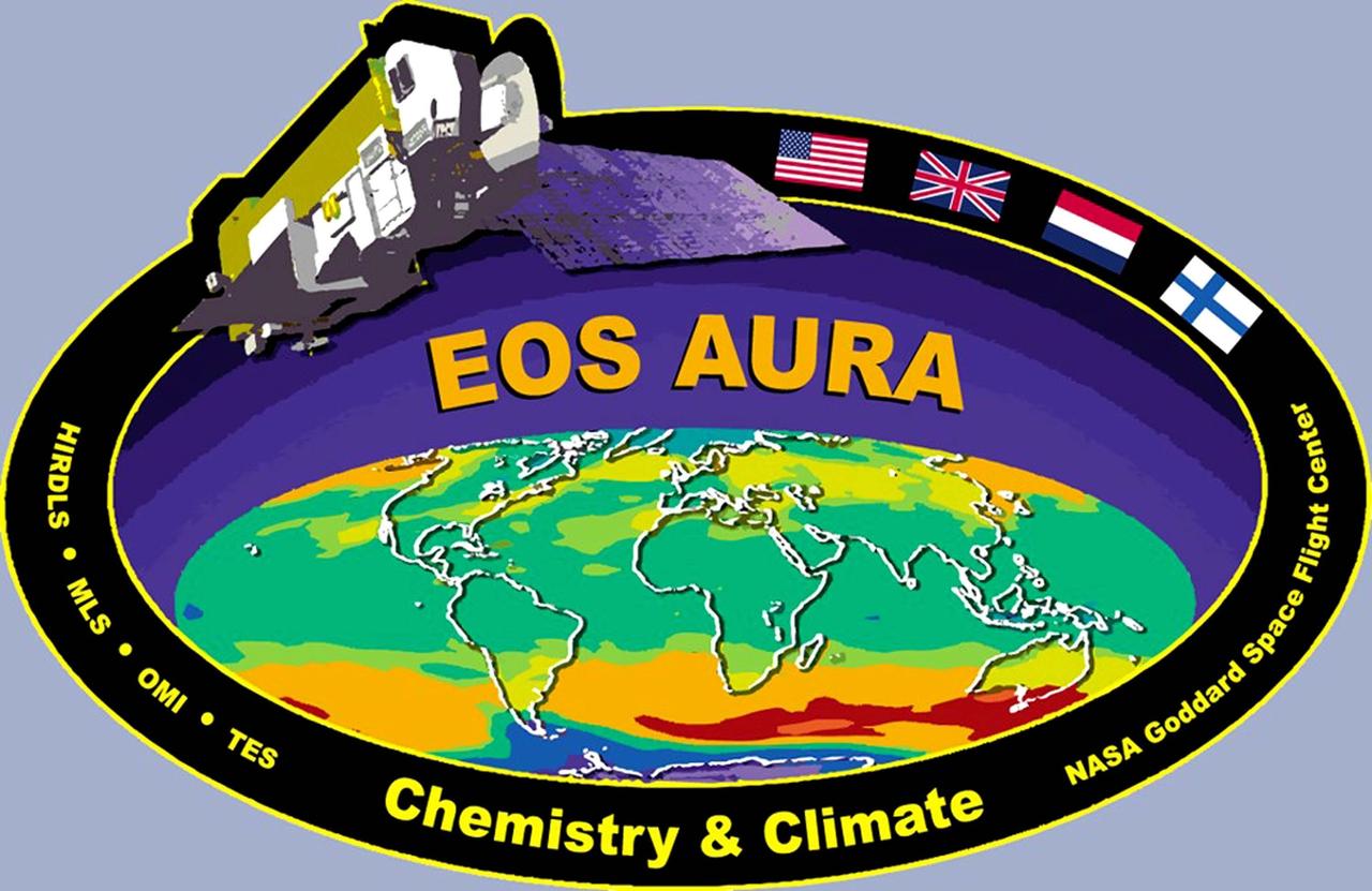 KENNEDY SPACE CENTER, FLA. -- EOS Aura: The Aura mission will study air quality, climate and stratospheric ozone depletion.  Aura is the third of NASA’s major Earth Observing System (EOS) orbital platforms and has four instruments. The Microwave Limb Sounder (MLS) and the High Resolution Dynamics Limb Sounder (HIRDLS) will make complementary measurements of stratospheric ozone and the chemicals that destroy it.  HIRDELS and MLS will also measure upper tropospheric water vapor and ozone - key gases that regulate climate. The Aura payload also includes the Tropospheric Emission Spectrometer (TES), which will make the first global measurements of lower atmospheric ozone, and the Ozone Monitoring Instrument (OMI), which will measure the total amount of atmospheric ozone as well as lower atmospheric dust, smoke and other aerosols. Aura is scheduled to launch in 2004.  The flags on the decals represent the countries participating in the mission: United States, United Kingdom, Netherlands and Finland.  The EOS Aura mission is being managed by NASA’s Goddard Space Flight Center.