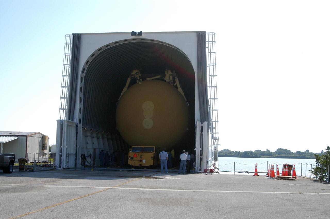 KENNEDY SPACE CENTER, FLA.  - After leaving the Vehicle Assembly Building, the external tank is loaded onto the barge at the Turn Basin on Launch Complex Area 39.  The barge will deliver the tank to the Michoud Space Systems Assembly Facility near New Orleans where redesign of the external tank is underway for Return to Flight.