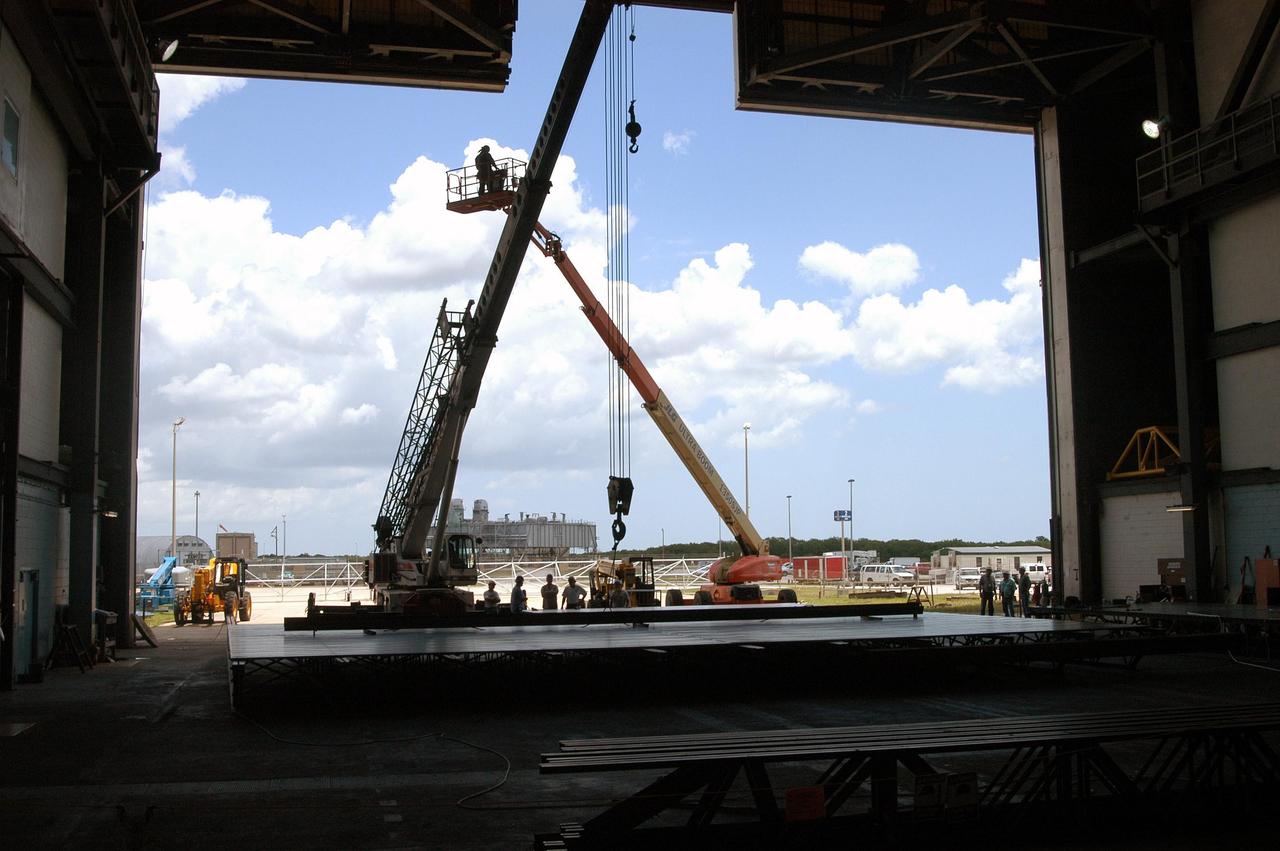 KENNEDY SPACE CENTER, FLA. - Viewed from the transfer aisle inside the Vehicle Assembly Building, one of the massive doors undergoes a face-lift. The North Transfer Aisle and the High Bay 3 Vertical and Horizontal doors have entered a 13-month restoration period to repair the damage caused by prolonged exposure to the Florida environment - one of the most corrosive in the nation. Extensive corrosion damage exists on the interior of the framework of the existing doors in both locations. All exterior siding is to be replaced, as well as all the hardware. The work contributes to the ongoing safety infrastructure upgrade efforts at Kennedy Space Center.