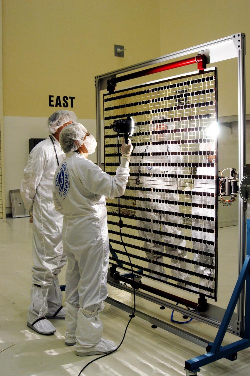 KENNEDY SPACE CENTER, FLA. - At Astrotech Space Operations in Titusville, Fla., the Mercury Surface, Space Environment, Geochemistry and Ranging (MESSENGER) spacecraft’s two solar arrays are undergoing cleaning inspections and voltage checks in preparation for installation on June 24 -25. One array will be installed each day, followed by a deployment test. The spacecraft will fly past Earth once, Venus twice and Mercury three times before starting a year-long orbital study of Mercury in March 2011. Launch is scheduled for July 30, 2004 from Pad 17-B at Cape Canaveral Air Force Station. MESSENGER was built for NASA by the Johns Hopkins University Applied Physics Laboratory in Laurel, Md.