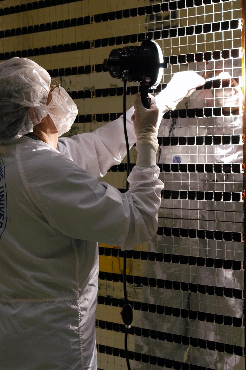 KENNEDY SPACE CENTER, FLA. - At Astrotech Space Operations in Titusville, Fla., the Mercury Surface, Space Environment, Geochemistry and Ranging (MESSENGER) spacecraft’s two solar arrays are undergoing cleaning inspections and voltage checks in preparation for installation on June 24 -25. One array will be installed each day, followed by a deployment test. The spacecraft will fly past Earth once, Venus twice and Mercury three times before starting a year-long orbital study of Mercury in March 2011. Launch is scheduled for July 30, 2004 from Pad 17-B at Cape Canaveral Air Force Station. MESSENGER was built for NASA by the Johns Hopkins University Applied Physics Laboratory in Laurel, Md.