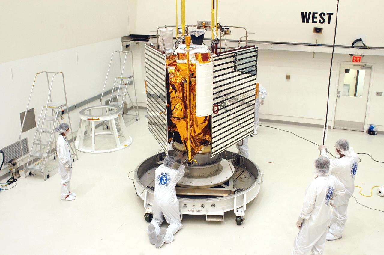 KENNEDY SPACE CENTER, FLA.  - At Astrotech in Titusville, Fla., technicians with The Johns Hopkins University Applied Physics Laboratory (APL) prepare the MESSESNGER spacecraft for a move to a hazardous processing facility in preparation for loading the spacecraft’s complement of hypergolic propellants.   MESSENGER is scheduled to launch Aug. 2 aboard a Boeing Delta II rocket from Pad 17-B, Cape Canaveral Air Force Station, Fla., on a journey to Mercury.  It will return to Earth for a gravity boost in July 2005, then fly past Venus twice, in October 2006 and June 2007. The spacecraft uses the tug of Venus’ gravity to resize and rotate its trajectory closer to Mercury’s orbit.  Three Mercury flybys, each followed about two months later by a course-correction maneuver, put MESSENGER in position to enter Mercury orbit in March 2011. During the flybys, MESSENGER will map nearly the entire planet in color, image most of the areas unseen by Mariner 10, and measure the composition of the surface, atmosphere and magnetosphere. It will be the first new data from Mercury in more than 30 years - and invaluable for planning MESSENGER’s year-long orbital mission.  MESSENGER was built for NASA by APL in Laurel, Md.