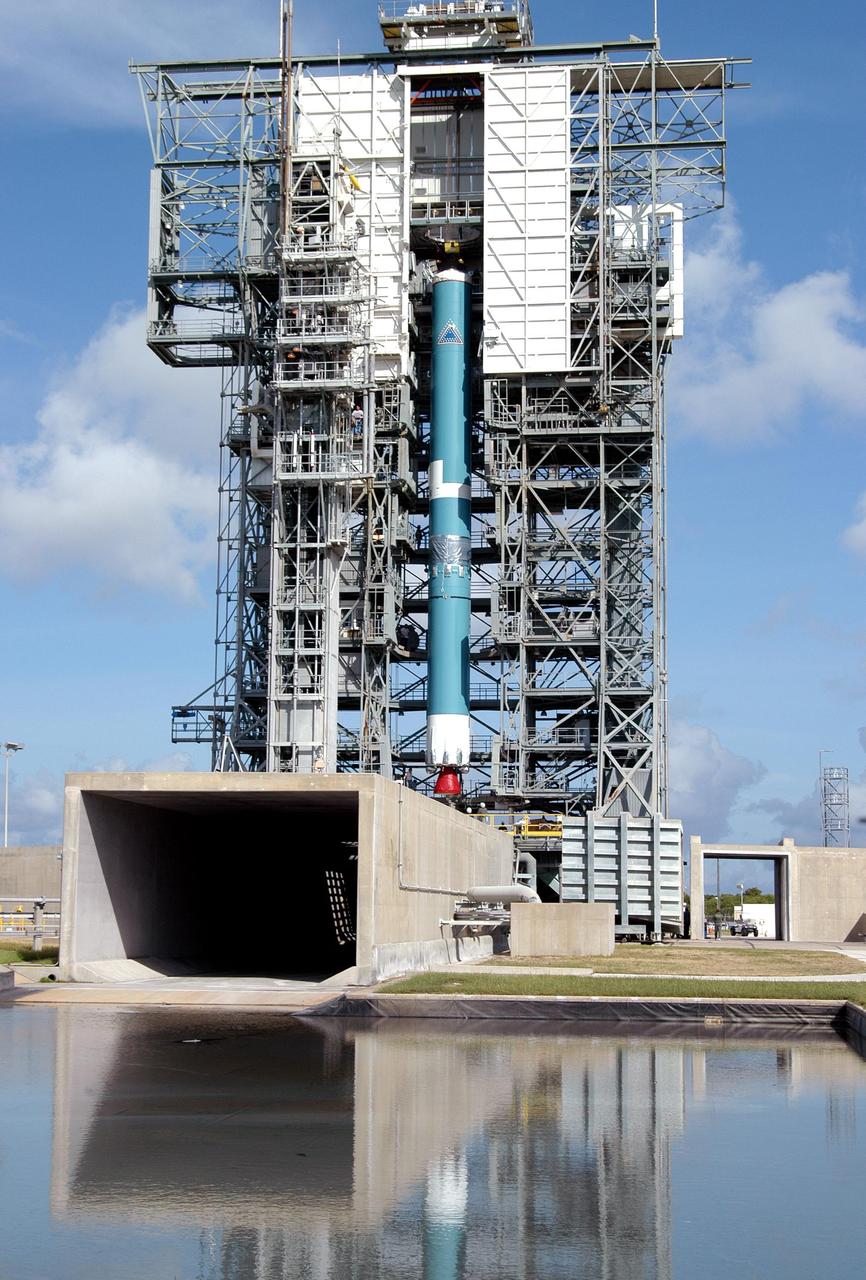 KENNEDY SPACE CENTER, FLA. -  - Viewed from across the cooling water pond is the mobile service tower with the first stage of the Boeing Delta II rocket inside.  The Delta II is the launch vehicle for the MESSENGER spacecraft, scheduled to lift off Aug. 2, bound for Mercury.   The spacecraft is expected to reach orbit around Mercury in March 2011.  MESSENGER was built for NASA by the Johns Hopkins University Applied Physics Laboratory in Laurel, Md.