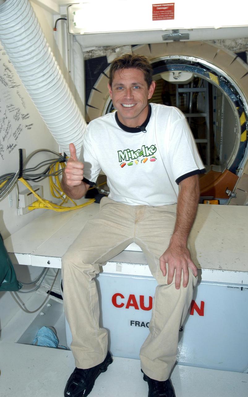 KENNEDY SPACE CENTER, FLA. - NASCAR Busch Series race driver Tim Fedewa poses in the White Room at Launch Pad 39A. Fedewa is on a tour of KSC for the Speed Channel TV show “NBS 24/7,” which is devoted to NASCAR. Other sites on his tour are the Launch Control Center, Vehicle Assembly Building and Orbiter Processing Facility.