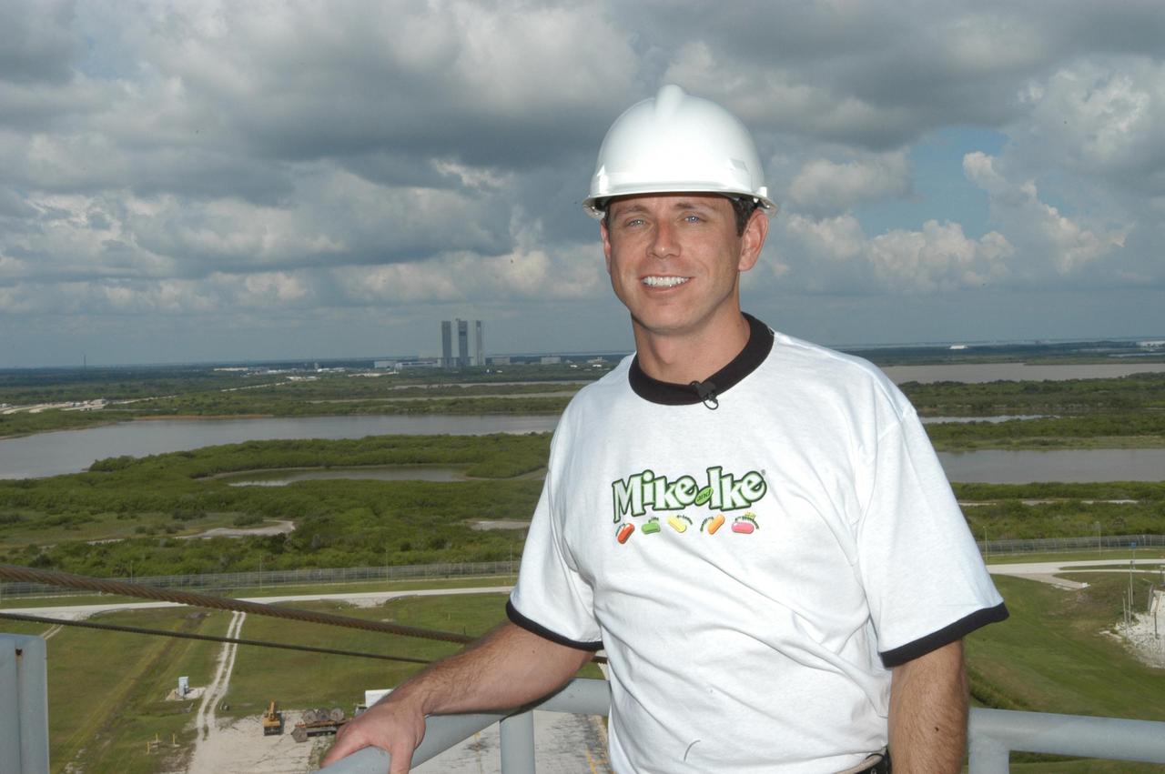 KENNEDY SPACE CENTER, FLA. - NASCAR Busch Series race driver Tim Fedewa completes his tour of KSC with a view from an upper level of the Fixed Service Structure on Launch Pad 39A. The Vehicle Assembly Building is in the background. Fedewa is touring KSC for the Speed Channel TV show “NBS 24/7,” which is devoted to NASCAR. Other sites on his tour are the Launch Control Center, Vehicle Assembly Building and the Orbiter Processing Facility.