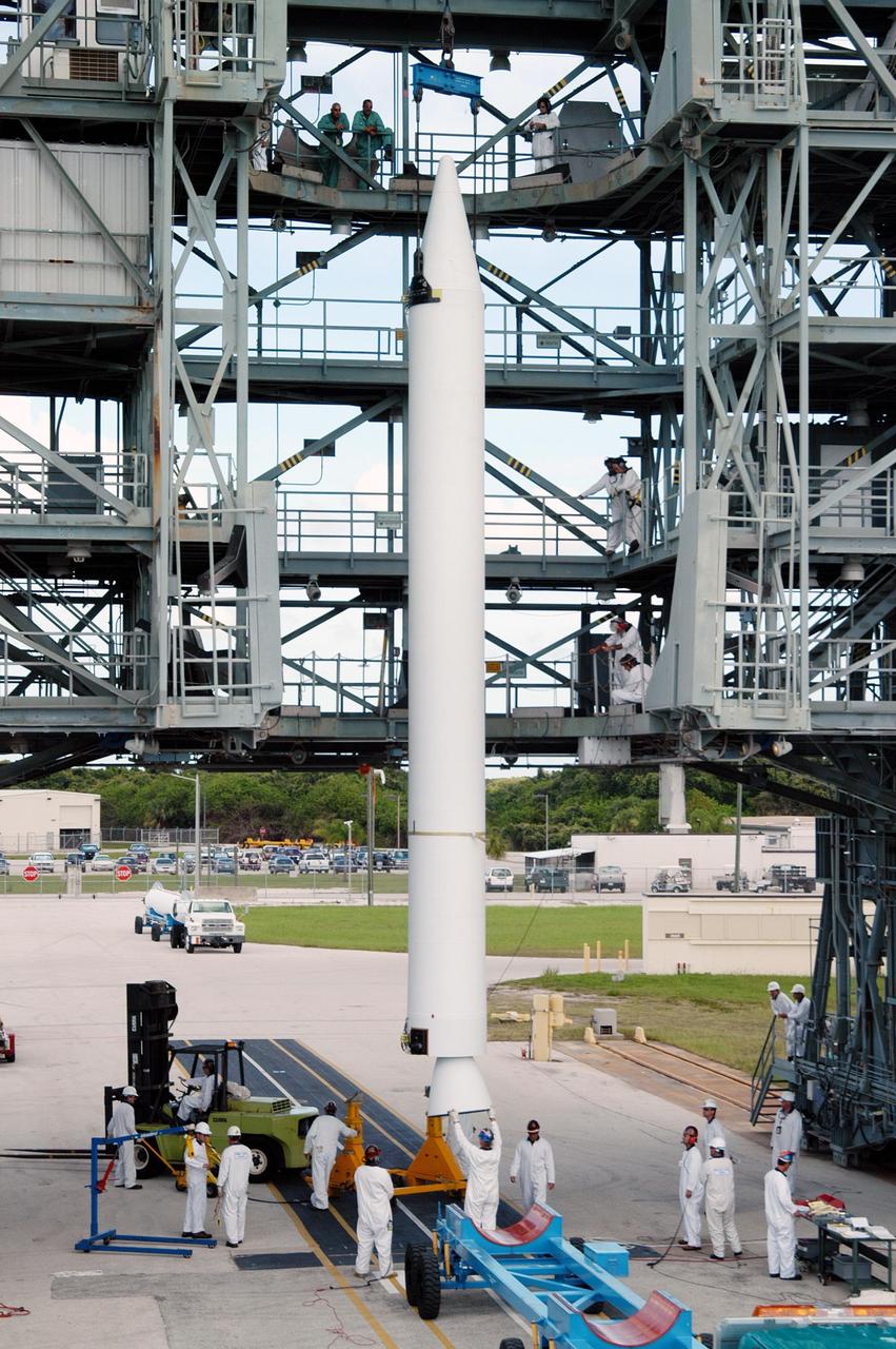 KENNEDY SPACE CENTER, FLA. -  At Pad 17-B, Cape Canaveral Air Force Station, the first Solid Rocket Booster  (SRB) for the MESSENGER spacecraft launch is held in a vertical position for lifting up the mobile service tower.  The SRB will be mated to the Boeing Delta II Heavy rocket for the Aug. 2 launch of MESSENGER to the planet Mercury.  The spacecraft is expected to reach orbit around Mercury in March 2011.  MESSENGER was built for NASA by the Johns Hopkins University Applied Physics Laboratory in Laurel, Md.