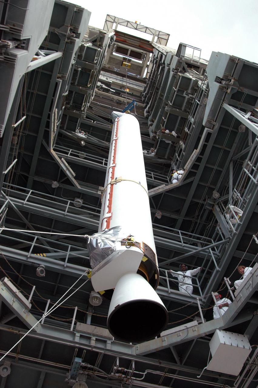KENNEDY SPACE CENTER, FLA. -  The first Solid Rocket Booster  (SRB) for the MESSENGER spacecraft launch is lifted up the mobile service tower at Pad 17-B, Cape Canaveral Air Force Station.  The SRB will be mated to the Boeing Delta II Heavy rocket for the Aug. 2 launch to the planet Mercury.  The spacecraft is expected to reach orbit around Mercury in March 2011.  MESSENGER was built for NASA by the Johns Hopkins University Applied Physics Laboratory in Laurel, Md.