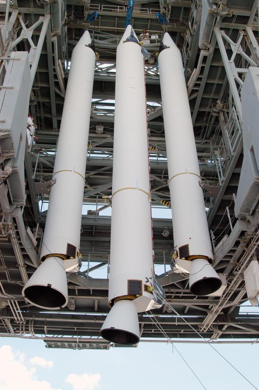 KENNEDY SPACE CENTER, FLA. -  On Pad 17-B, Cape Canaveral Air Force Station, a third Solid Rocket Booster (SRB) is lifted up the mobile service tower to join the other SRBs there.  They will later be mated to the Boeing Delta II Heavy rocket for the Aug. 2 launch of the MESSENGER spacecraft to the planet Mercury.  The spacecraft is expected to reach orbit around Mercury in March 2011.  MESSENGER was built for NASA by the Johns Hopkins University Applied Physics Laboratory in Laurel, Md.