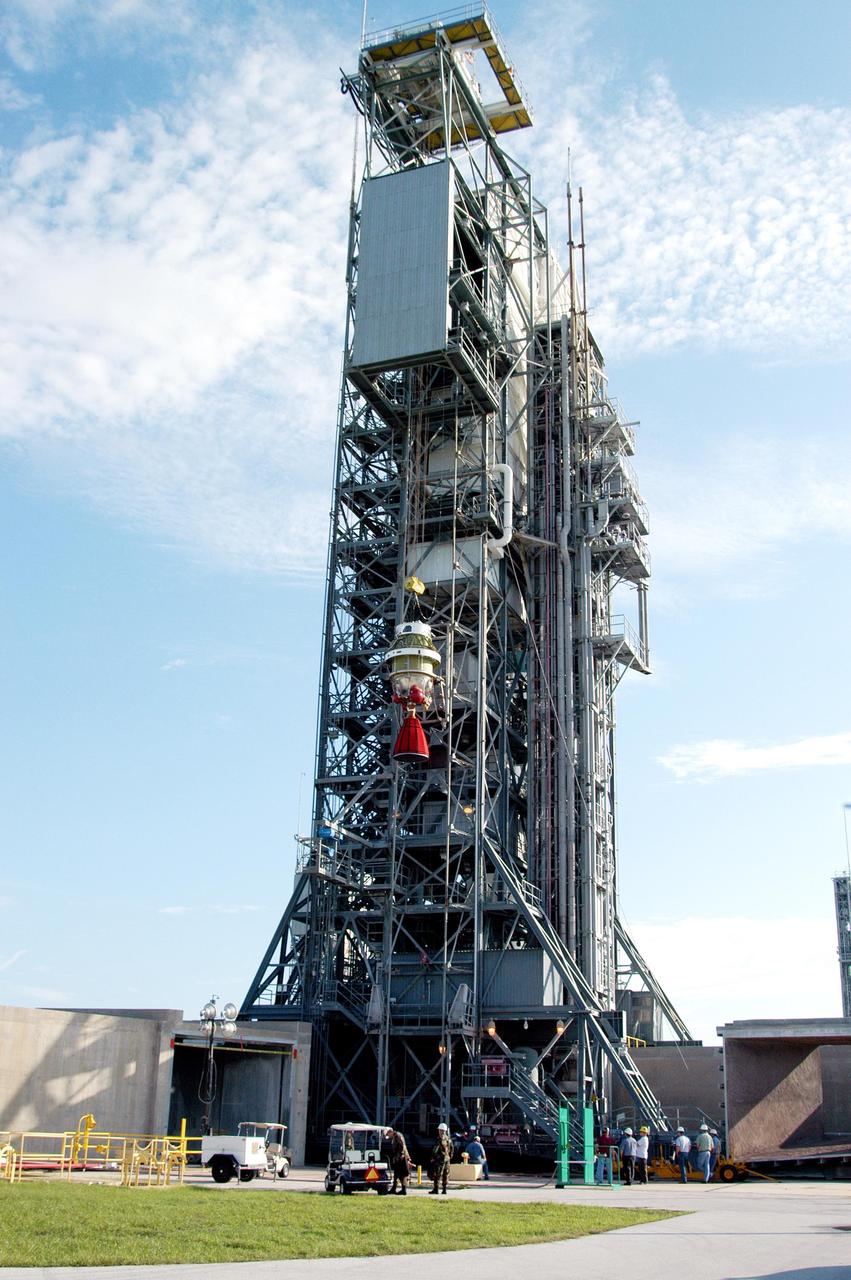 KENNEDY SPACE CENTER, FLA. -  The Boeing Delta II Heavy second-stage engine, the Aerojet AJ10-118K, is lifted up the mobile service tower at Pad 17-B, Cape Canaveral Air Force Station.  The Delta II is the launch vehicle for the MESSENGER (Mercury Surface, Space Environment, Geochemistry and Ranging) spacecraft, scheduled to lift off Aug. 2.  Bound for Mercury, the spacecraft is expected to reach orbit around the planet in March 2011.  MESSENGER was built for NASA by the Johns Hopkins University Applied Physics Laboratory in Laurel, Md.
