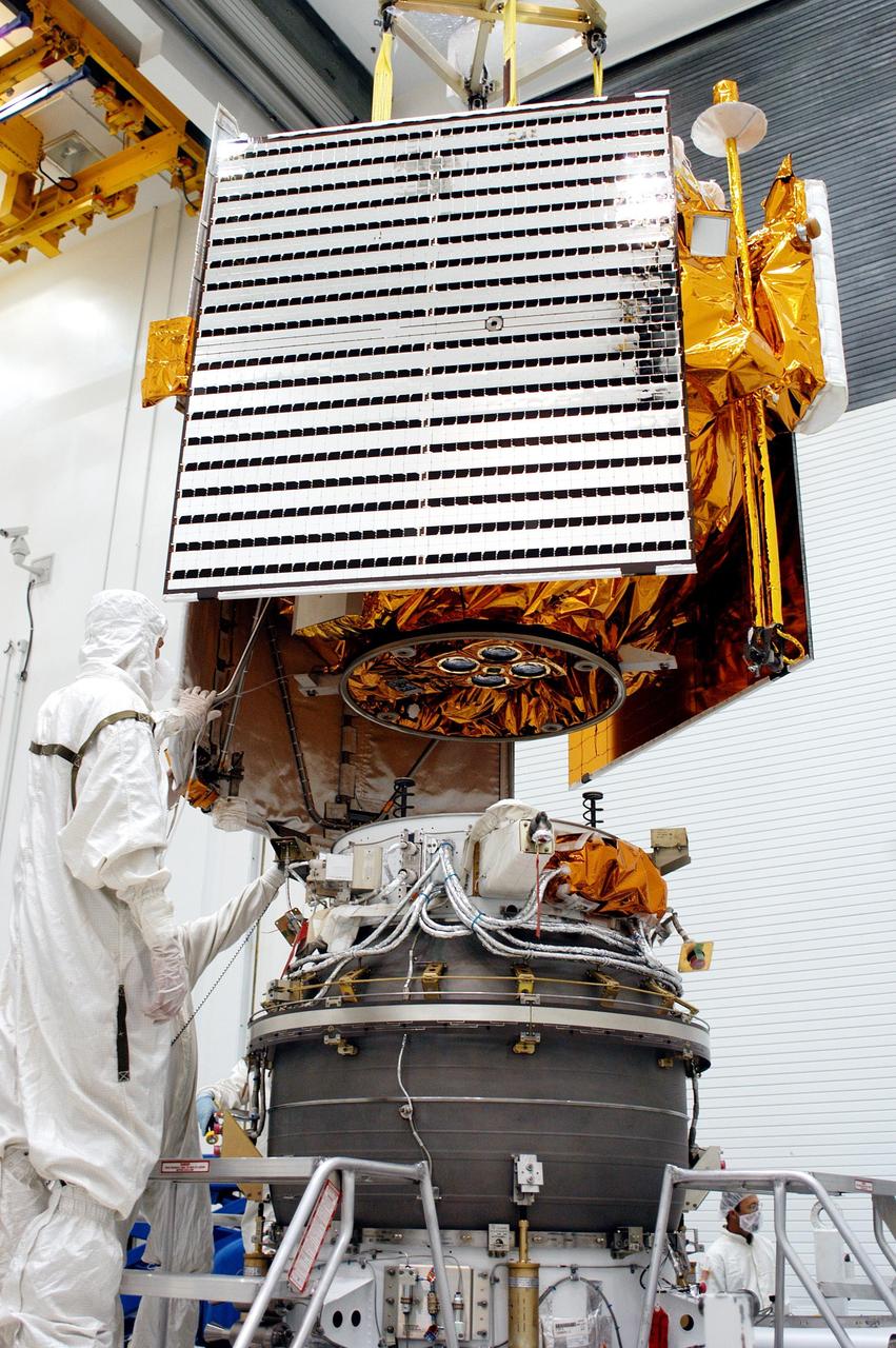 KENNEDY SPACE CENTER, FLA. -  At Astrotech Space Operations in Titusville, Fla., the MESSENGER spacecraft is lowered toward the Payload Assist Module, the Boeing Delta II third stage, for mating. MESSENGER (Mercury Surface, Space Environment, Geochemistry and Ranging) is scheduled to launch Aug. 2 aboard a Boeing Delta II rocket from Pad 17-B, Cape Canaveral Air Force Station, Fla. It will return to Earth for a gravity boost in July 2005, then fly past Venus twice, in October 2006 and June 2007. It is expected to enter Mercury orbit in March 2011.  MESSENGER was built for NASA by the Johns Hopkins University Applied Physics Laboratory in Laurel, Md.  Processing is being done at Astrotech Space Operations in Titusville, Fla.