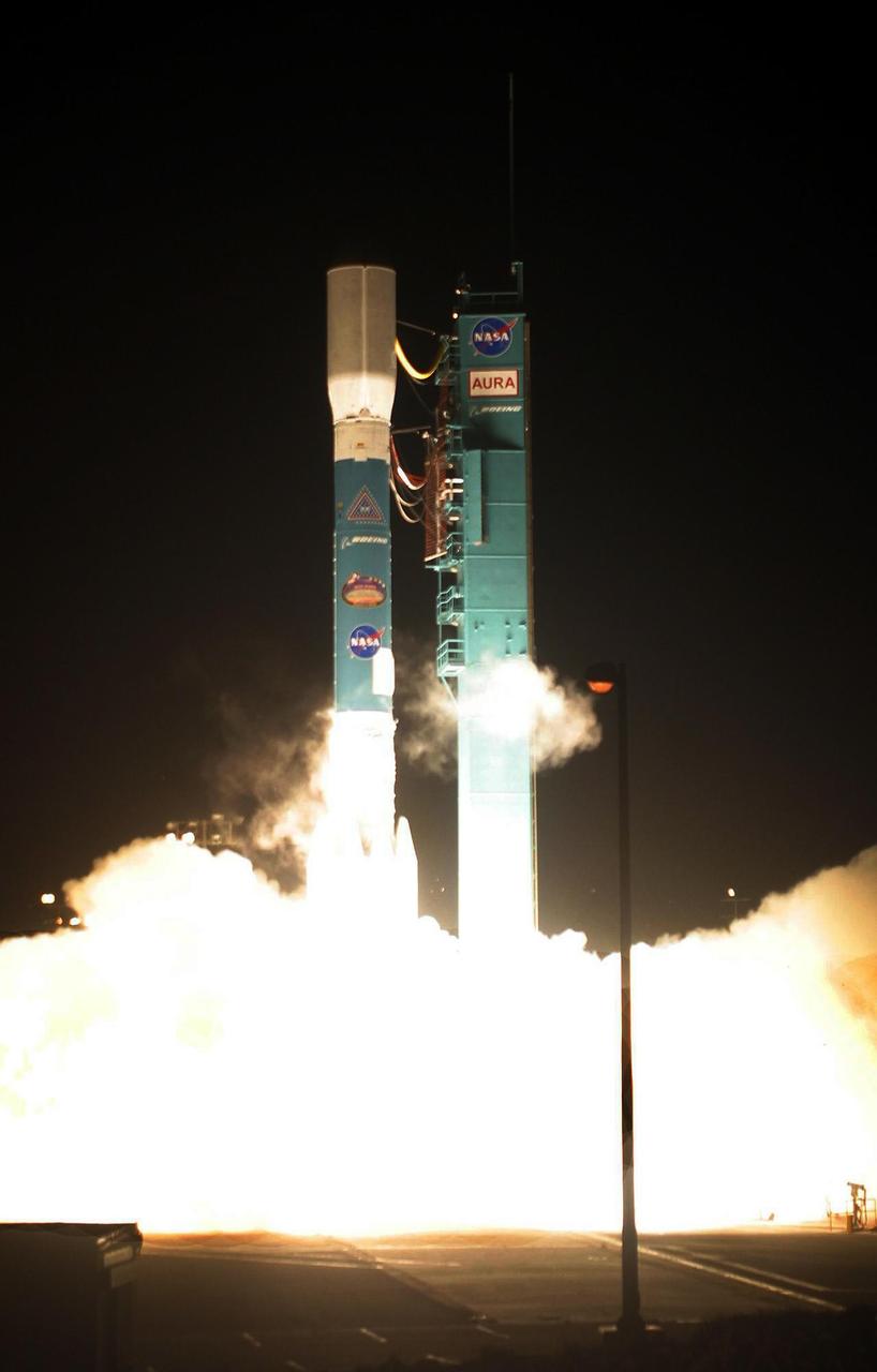 KENNEDY SPACE CENTER, FLA. -   With rockets and main engine firing, the Boeing Delta II launch vehicle leaps off the pad at NASA’s Space Complex 2 on Vandenberg Air Force Base, Calif., carrying the Aura spacecraft.  Aura, a mission dedicated to the health of Earth's atmosphere, successfully launched today at 3:01:59 a.m. Pacific Time.  Spacecraft separation occurred at 4:06 a.m. Pacific Time, inserting Aura into a 438-mile orbit. NASA’s latest Earth-observing satellite, Aura will help us understand and protect the air we breathe. Aura will also help scientists understand how the composition of the atmosphere affects and responds to Earth's changing climate. The results from this mission will help scientists better understand the processes that connect local and global air quality.  With the launch of Aura, the first series of NASA’s Earth Observing System satellites is complete. The other satellites are Terra, which monitors land, and Aqua, which observes Earth’s water cycle.  [Photo: Boeing/Thom Baur]