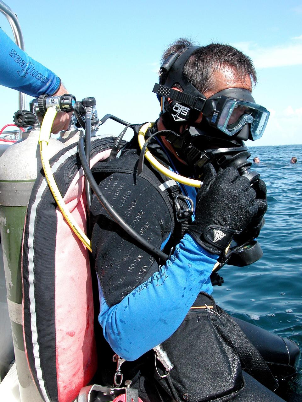 KENNEDY SPACE CENTER, FLA. - In the water for a practice dive in the ocean offshore from Key Largo is astronaut John Herrington.  He is commander of the NASA Extreme Environment Mission Operations 6 (NEEMO-6) mission team.  The others are Nick Patrick, Doug Wheelock, and Tara Ruttley, a biomedical engineer.  The NEEMO-6 mission involves exposing an astronaut/scientist crew to a real mission experience in an extreme environment - the NOAA undersea station Aquarius - to prepare for future space flight.  Spacewalk-like diving excursions and field-tests on a variety of biomedical equipment are designed to help astronauts living aboard the International Space Station.  To prepare for their 10-day stay, the team had dive training twice a day at the Life Support Buoy, anchored above Aquarius.