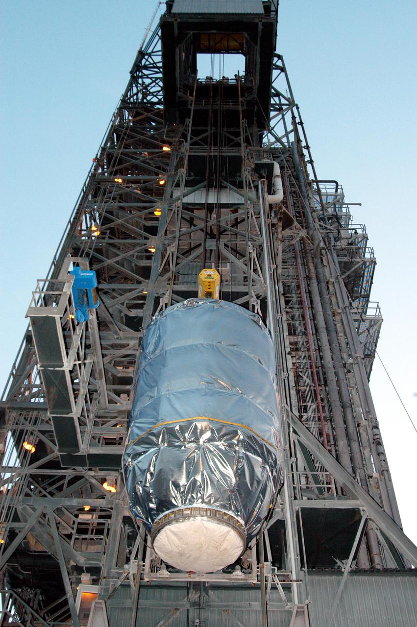 KENNEDY SPACE CENTER, FLA. -  On Launch Pad 17-B at Cape Canaveral Air Force Station, the MESSENGER spacecraft is lifted up the mobile service tower, where it will be mated to the Boeing Delta II Heavy rocket.  Liftoff is scheduled for Aug. 2.  The spacecraft is expected to reach orbit around the planet in March 2011.  MESSENGER was built for NASA by the Johns Hopkins University Applied Physics Laboratory in Laurel, Md.