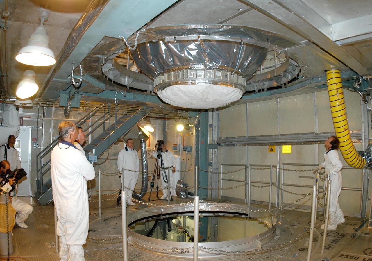 KENNEDY SPACE CENTER, FLA. -  On Launch Pad 17-B at Cape Canaveral Air Force Station, the MESSENGER spacecraft is lowered toward the Boeing Delta II Heavy rocket for mating. Liftoff is scheduled for Aug. 2.  The spacecraft is expected to reach orbit around the planet in March 2011.  MESSENGER was built for NASA by the Johns Hopkins University Applied Physics Laboratory in Laurel, Md.