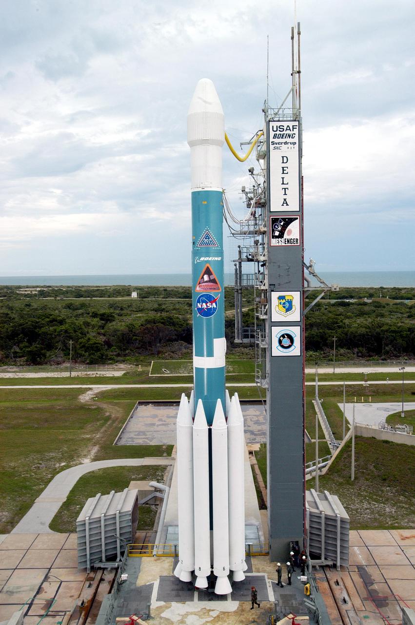KENNEDY SPACE CENTER, FLA. - On Launch Pad 17-B at Cape Canaveral Air Force Station, the Mobile Service Tower has been removed from around the MESSENGER (MErcury Surface, Space ENvironment, GEochemistry and Ranging) spacecraft aboard a Delta II rocket. The nine solid booster rockets on this Delta model 7925-H provide it with heavy lift capability. MESSENGER is ready for liftoff on Aug. 2 at 2:16 a.m. EDT and is expected to enter Mercury orbit in March 2011. MESSENGER was built for NASA by the Johns Hopkins University Applied Physics Laboratory in Laurel, Md.