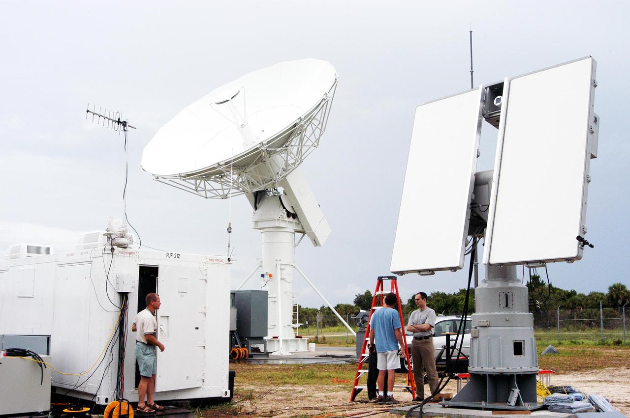 KENNEDY SPACE CENTER, FLA. - A C-band (left) and an X-band radar antenna are positioned to observe the MESSENGER (Mercury Surface, Space Environment, Geochemistry and Ranging) launch.  The antennas are on loan to KSC from the USNS Pathfinder, a U.S. Navy instrumentation ship.  They have been installed at  site north of Haulover Canal where the National Center for Atmospheric Research previously had a radar for thunderstorm research.  NASA is evaluating the pair of radars for their ability to observe possible debris coming from the Space Shuttle during launch, part of NASA’s initiative to return the Space Shuttle to flight.