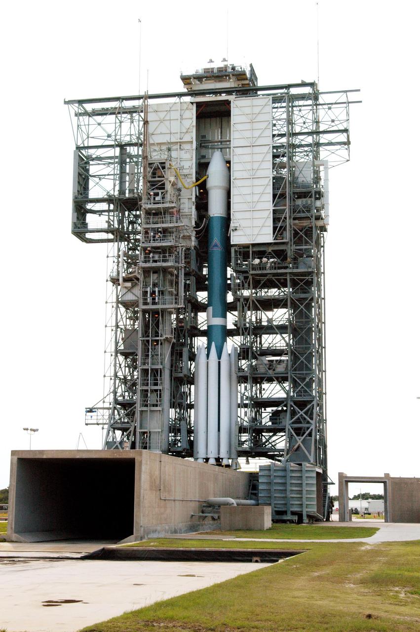 KENNEDY SPACE CENTER, FLA. - On Launch Pad 17-B, Cape Canaveral Air Force Station, the Boeing Delta II rocket with the Mercury Surface, Space Environment, Geochemistry and Ranging (MESSENGER) spacecraft aboard waits for rollback of the mobile service tower and a second launch attempt in two days. The first attempt Aug. 2 was postponed due to lightning potential from residual clouds that were associated with Tropical Storm Alex. The launch of MESSENGER on a seven-year journey to the planet Mercury is rescheduled for this date at 2:15:56 a.m. EDT at the opening of a 12-second launch window. MESSENGER will fly by Earth, Venus and Mercury several times to burn off energy before making its final approach to the inner planet on March 18, 2011. MESSENGER was built for NASA by the Johns Hopkins University Applied Physics Laboratory in Laurel, Md.