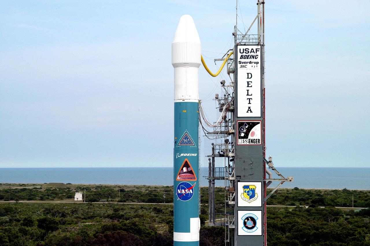 KENNEDY SPACE CENTER, FLA. - Framed by a blue hazy sky and bluer Atlantic Ocean, the Boeing Delta II rocket with the Mercury Surface, Space Environment, Geochemistry and Ranging (MESSENGER) spacecraft aboard is ready for launch on a seven-year journey to the planet Mercury. This is the second launch attempt in two days after the first attempt Aug. 2 was postponed due to lightning potential from residual clouds that were associated with Tropical Storm Alex. The launch of MESSENGER is rescheduled for this date at 2:15:56 a.m. EDT at the opening of a 12-second launch window. MESSENGER will fly by Earth, Venus and Mercury several times to burn off energy before making its final approach to the inner planet on March 18, 2011. MESSENGER was built for NASA by the Johns Hopkins University Applied Physics Laboratory in Laurel, Md.