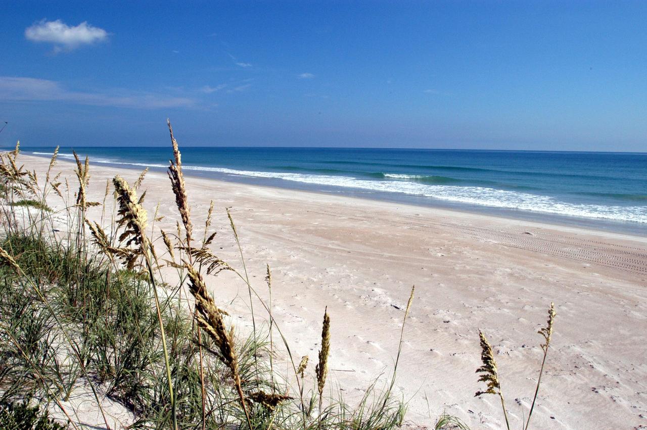 KENNEDY SPACE CENTER, FLA. - These pristine sand dunes near the launch pads at KSC are gently washed by the calm blue Atlantic Ocean.  Sea oats stand like sentinels on the dunes, which are part of the Canaveral National Seashore, managed by the National Wildlife Service.