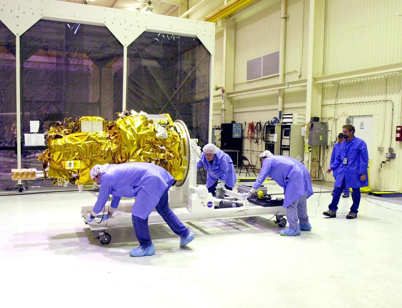 KENNEDY SPACE CENTER, FLA. - At Vandenberg Air Force Base in California, the Demonstration of Autonomous Rendezvous Technology (DART) spacecraft is prepared for rotation from horizontal to vertical. It will be lifted onto a test stand for launch processing activities. The spacecraft was developed for NASA by Orbital Sciences Corporation in Dulles, Va., to prove technologies for locating and maneuvering near an orbiting satellite. DART will be launched on a Pegasus launch vehicle. At about 40,000 feet over the Pacific Ocean, the Pegasus will be released from Orbital’s Stargazer L-1011 aircraft, fire its rocket motors and boost DART into a polar orbit approximately 472 miles by 479 miles. Once in orbit, DART will rendezvous with a target satellite, the Multiple Paths, Beyond-Line-of-Site Communications satellite, also built by Orbital Sciences. DART will then perform several close proximity operations, such as moving toward and away from the satellite using navigation data provided by onboard sensors. DART is scheduled for launch no earlier than Oct. 18.