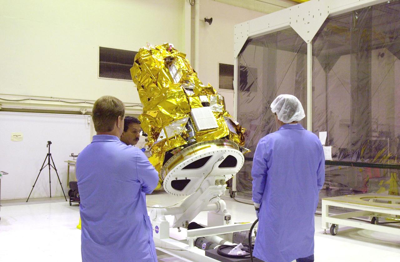 KENNEDY SPACE CENTER, FLA. - At Vandenberg Air Force Base in California, the Demonstration of Autonomous Rendezvous Technology (DART) spacecraft is raised to a vertical position. It will be lifted onto a test stand for launch processing activities. The spacecraft was developed for NASA by Orbital Sciences Corporation in Dulles, Va., to prove technologies for locating and maneuvering near an orbiting satellite. DART will be launched on a Pegasus launch vehicle. At about 40,000 feet over the Pacific Ocean, the Pegasus will be released from Orbital’s Stargazer L-1011 aircraft, fire its rocket motors and boost DART into a polar orbit approximately 472 miles by 479 miles. Once in orbit, DART will rendezvous with a target satellite, the Multiple Paths, Beyond-Line-of-Site Communications satellite, also built by Orbital Sciences. DART will then perform several close proximity operations, such as moving toward and away from the satellite using navigation data provided by onboard sensors. DART is scheduled for launch no earlier than Oct. 18.